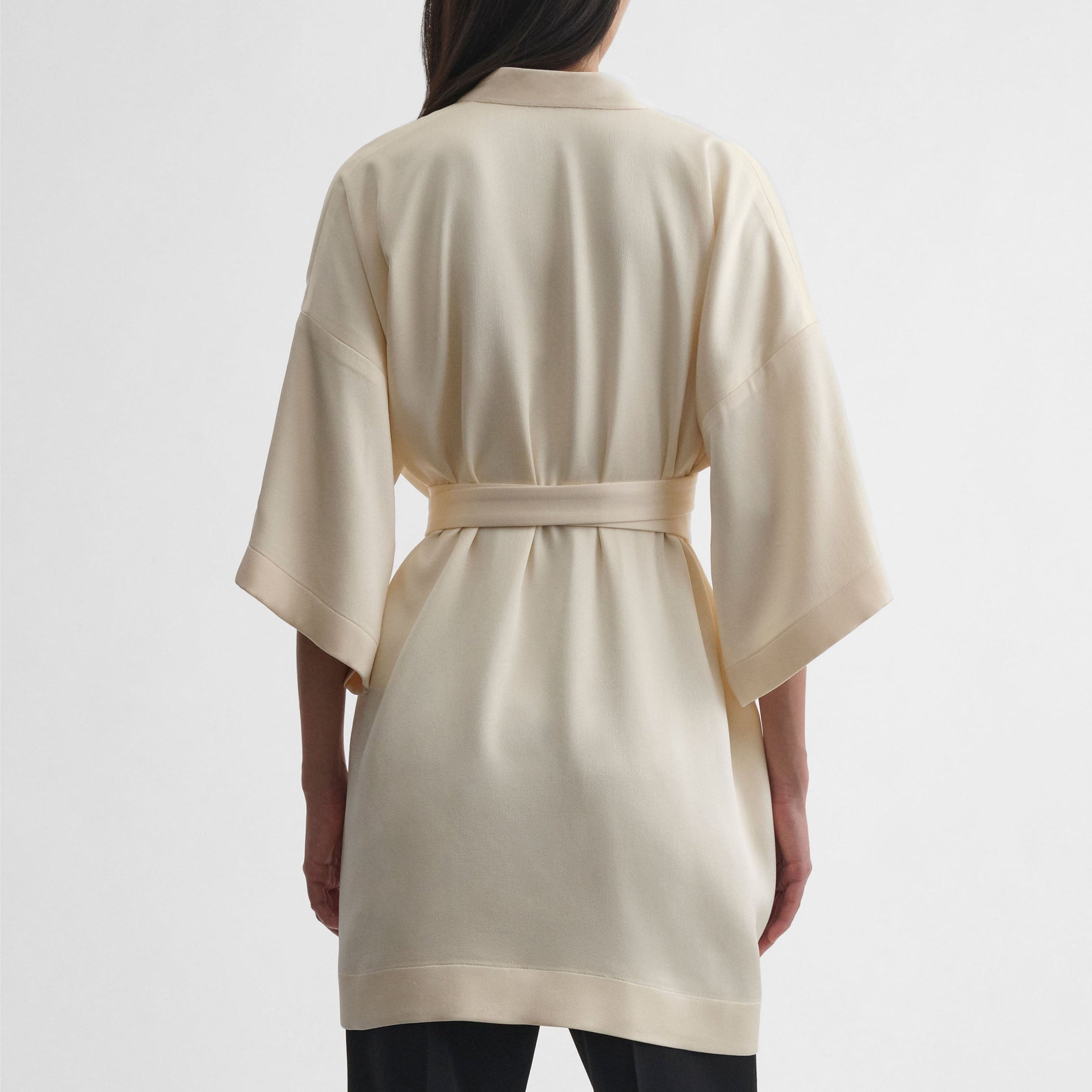 Back view of model wearing CROPPED ROBE DRESS in cream viscose