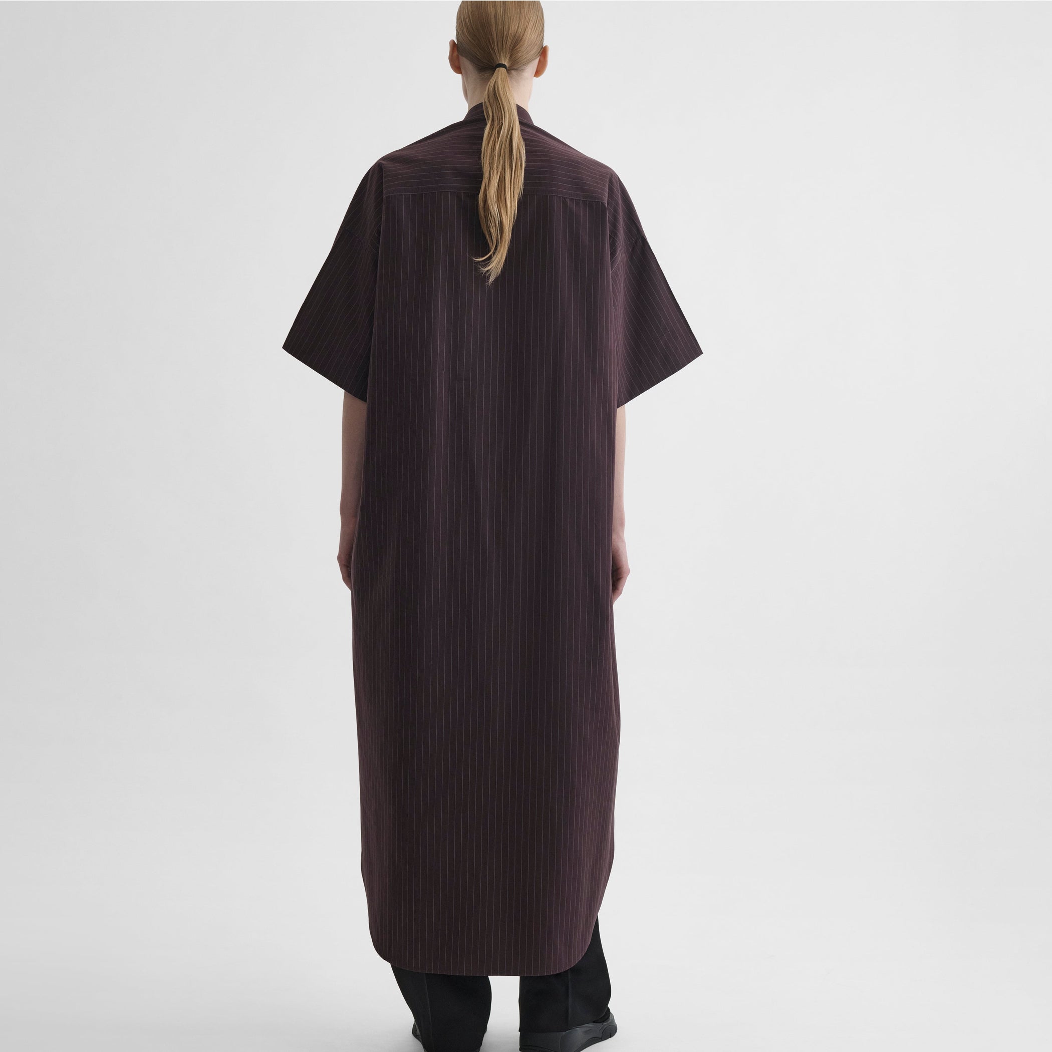 Back view of model wearing LONG SHIRT DRESS in black cherry cotton