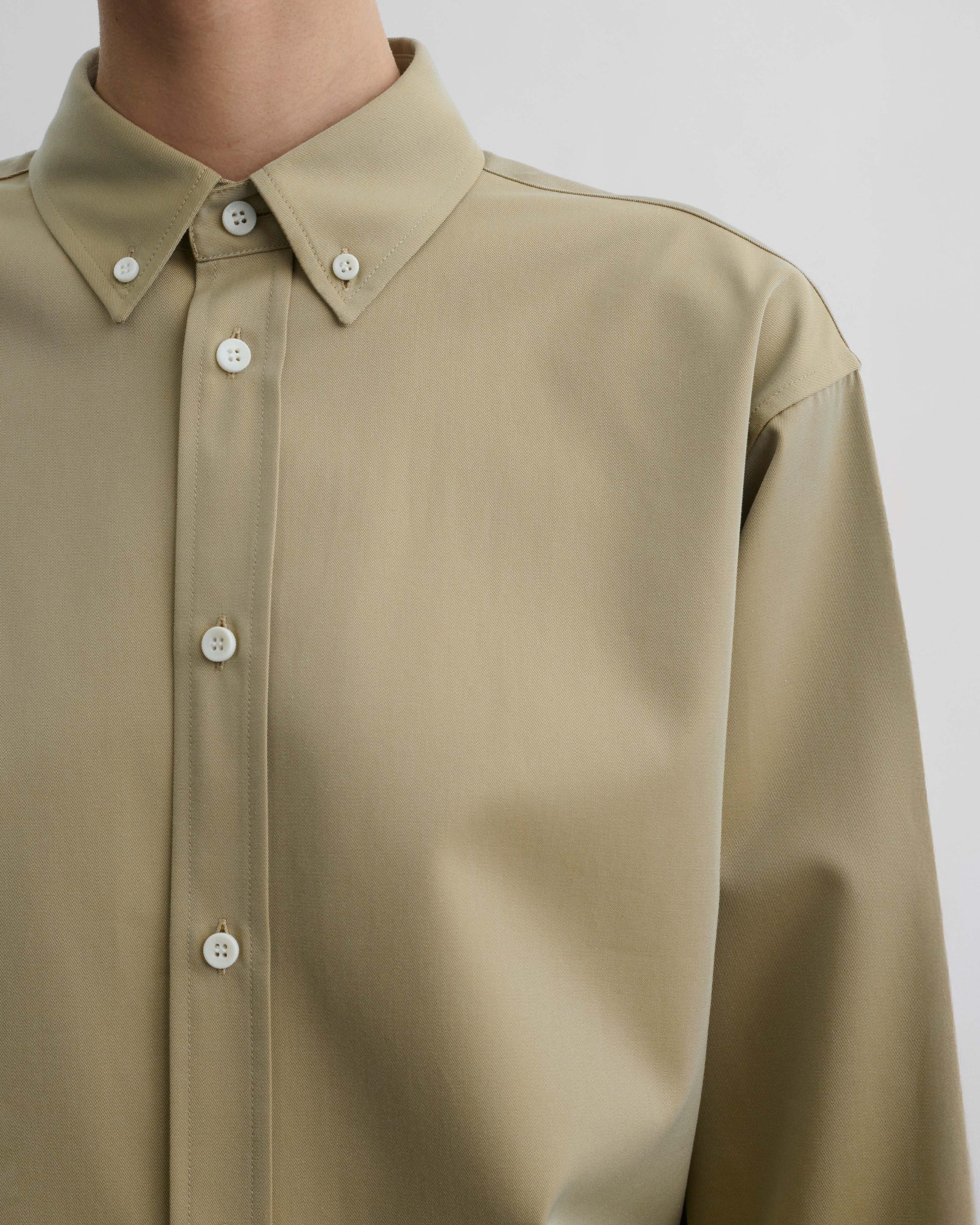Front detail view of model wearing BUTTON COLLAR SHIRT in trench cotton