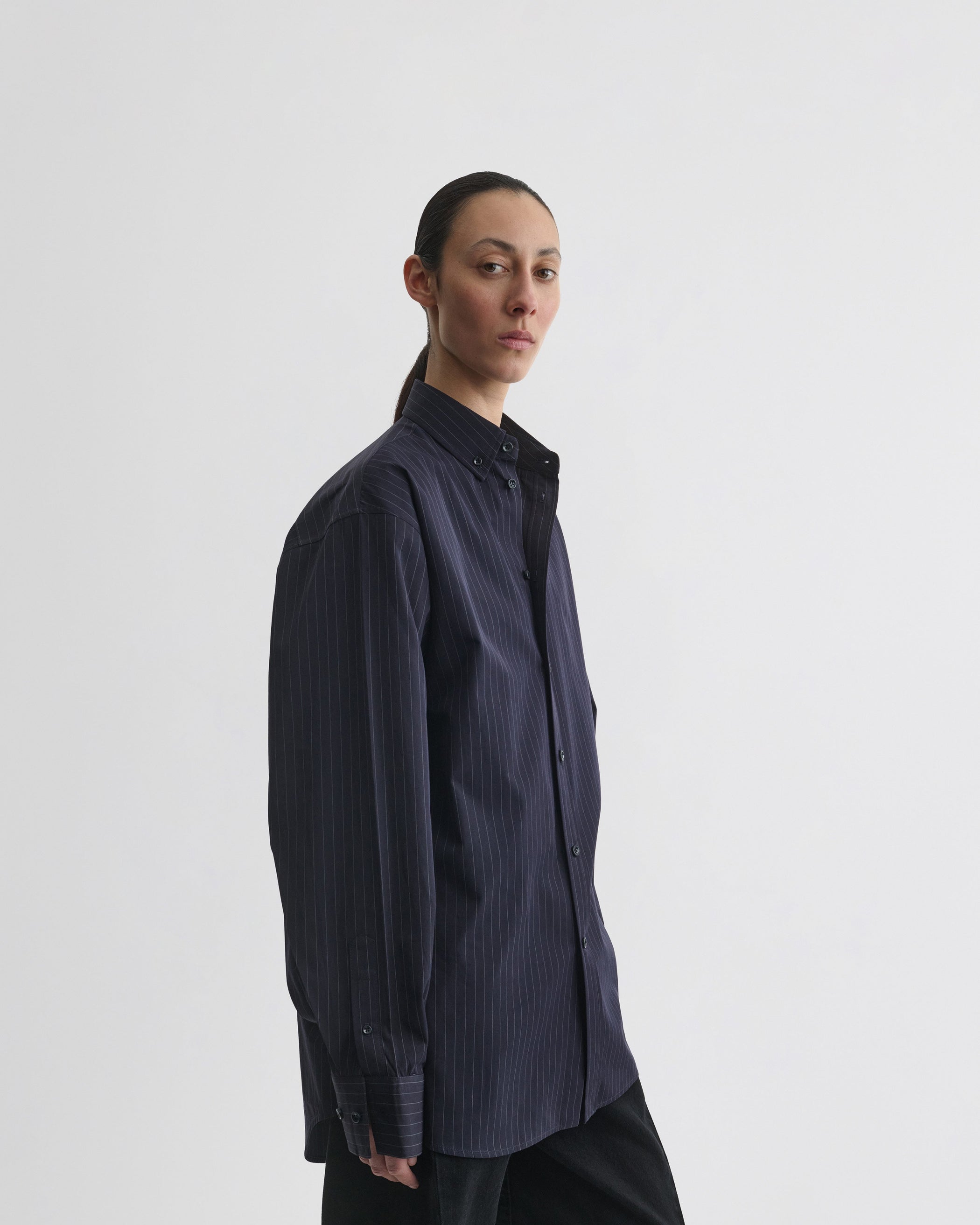 View of button collar shirt in midnight pinstripe cotton