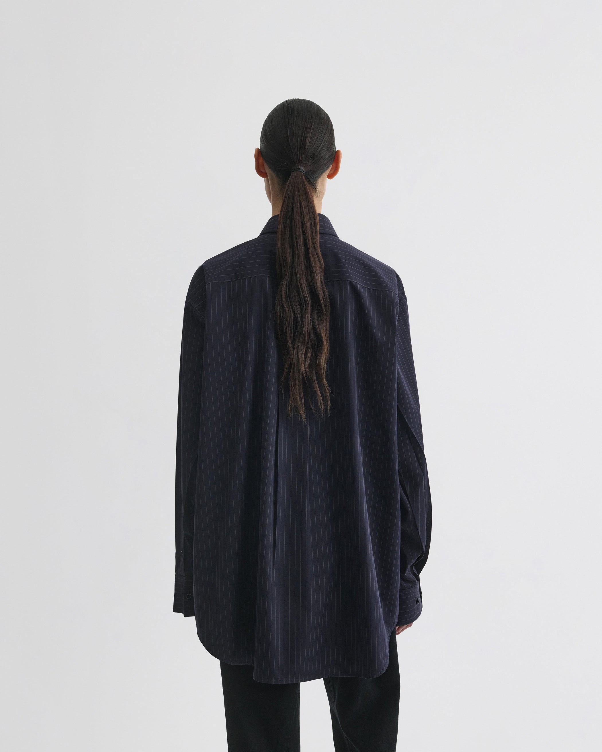 View of button collar shirt in midnight pinstripe cotton