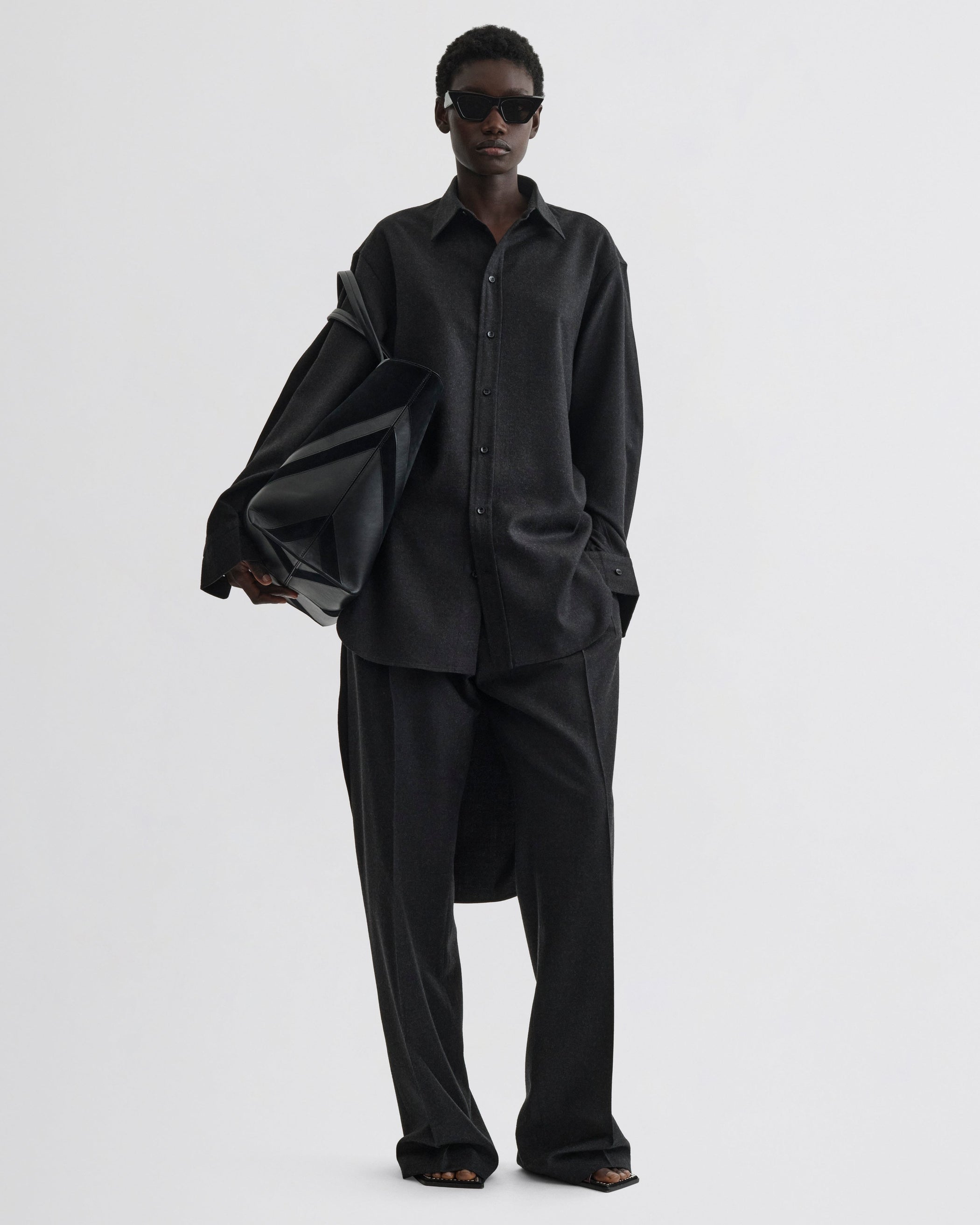 Front view of model wearing Elongated Shirt in charcoal wool