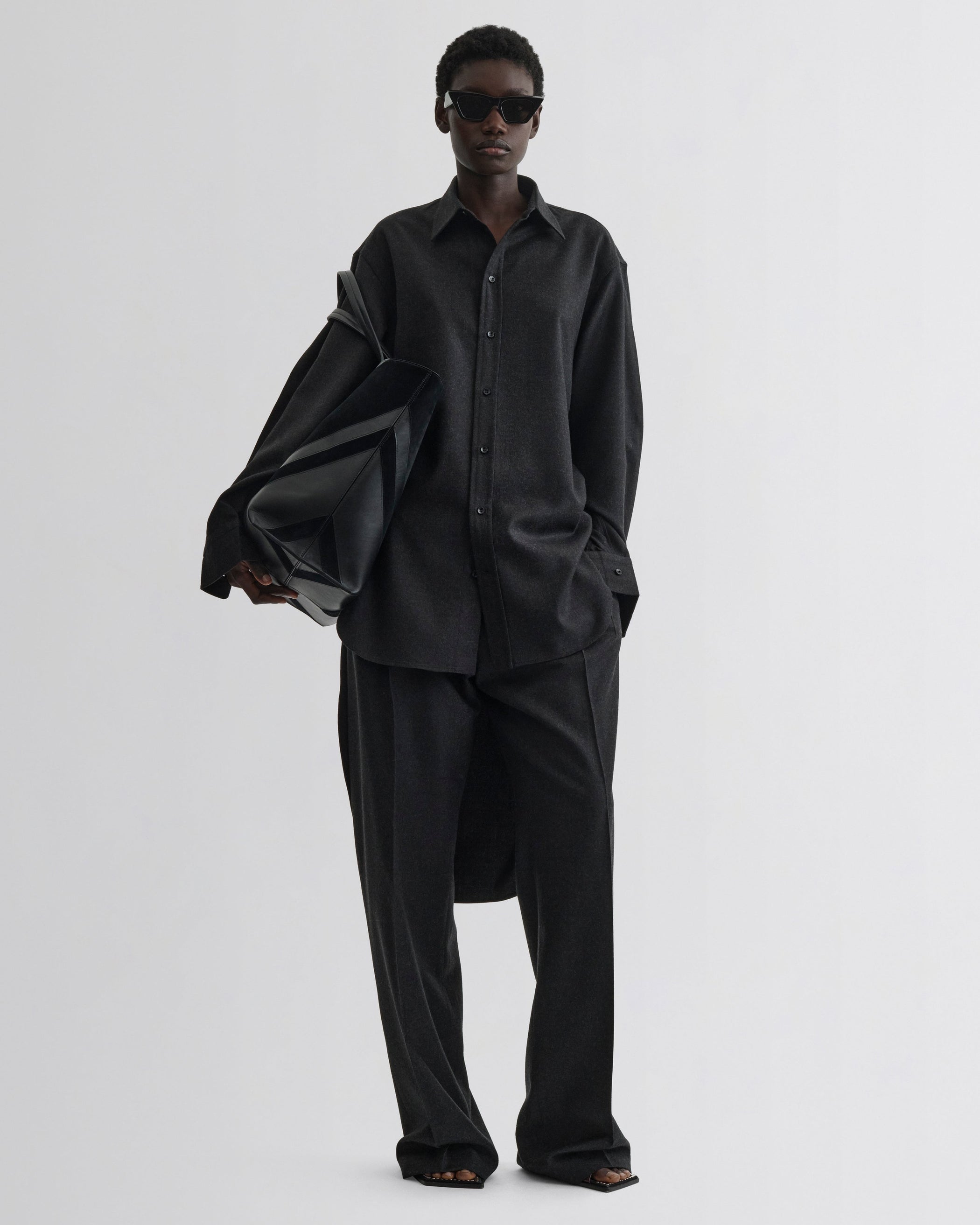 Front model view of Elongated Shirt in charcoal wool