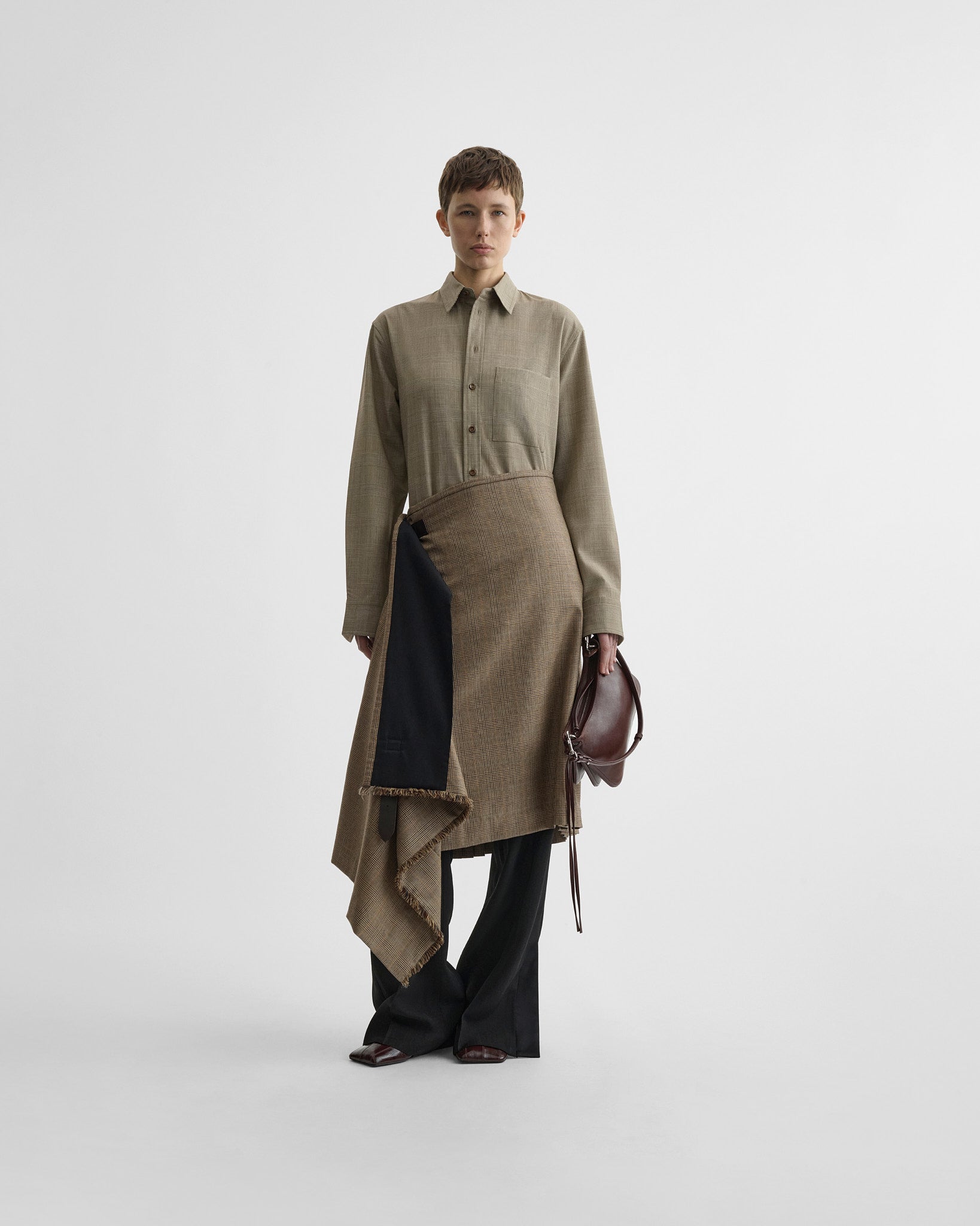 Front view of model wearing kilt in tobacco wool