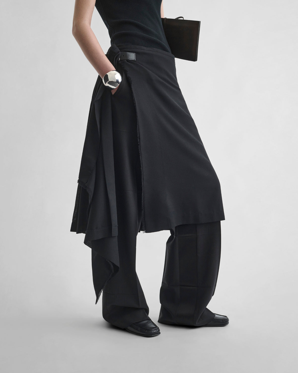 Detail view of model wearing KILT in black wool