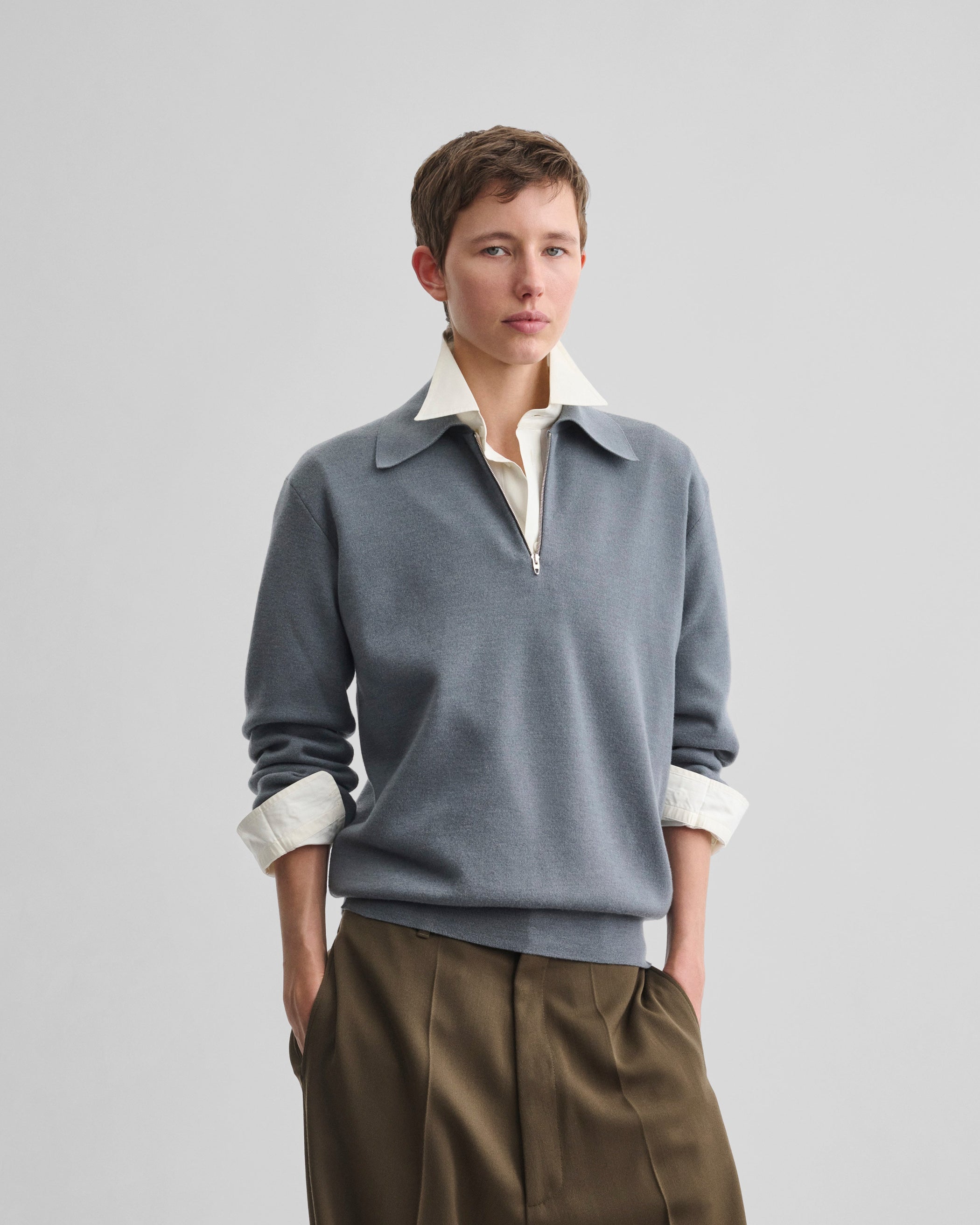Front view of model wearing ZIP POLO in grey blue wool