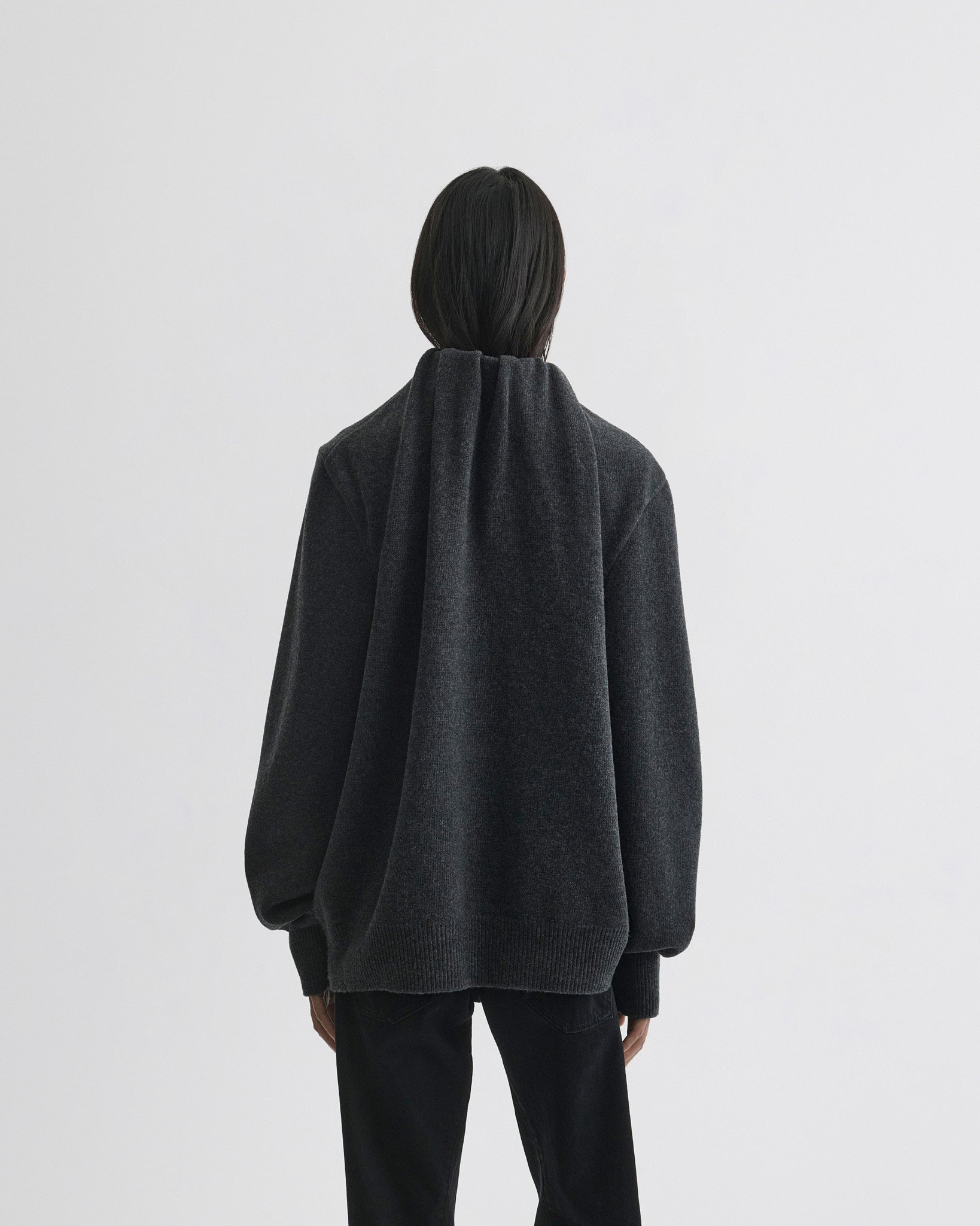 Back view of model wearing SOFT RIDGE JUMPER in grey melange wool