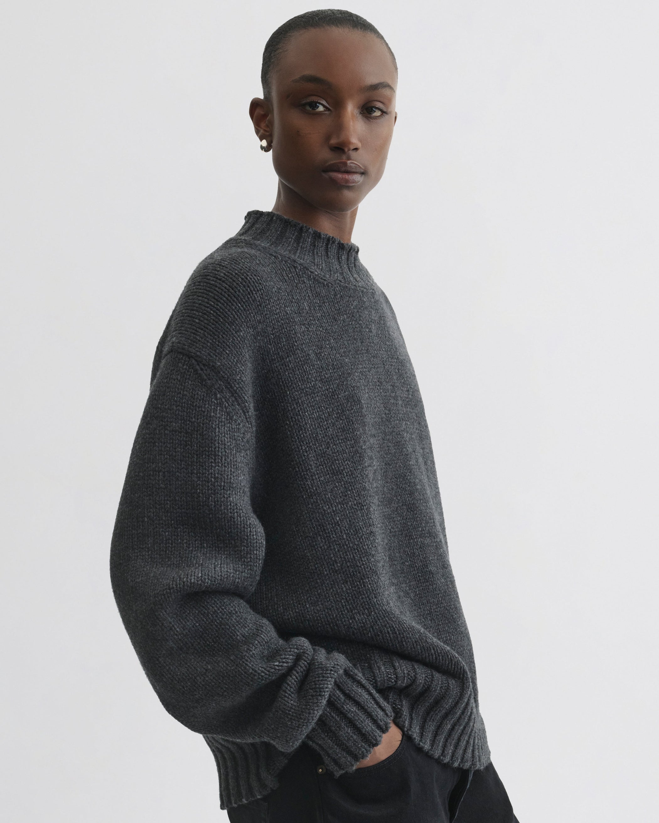 Side view of model wearing Crewneck Jumper in grey cashmere