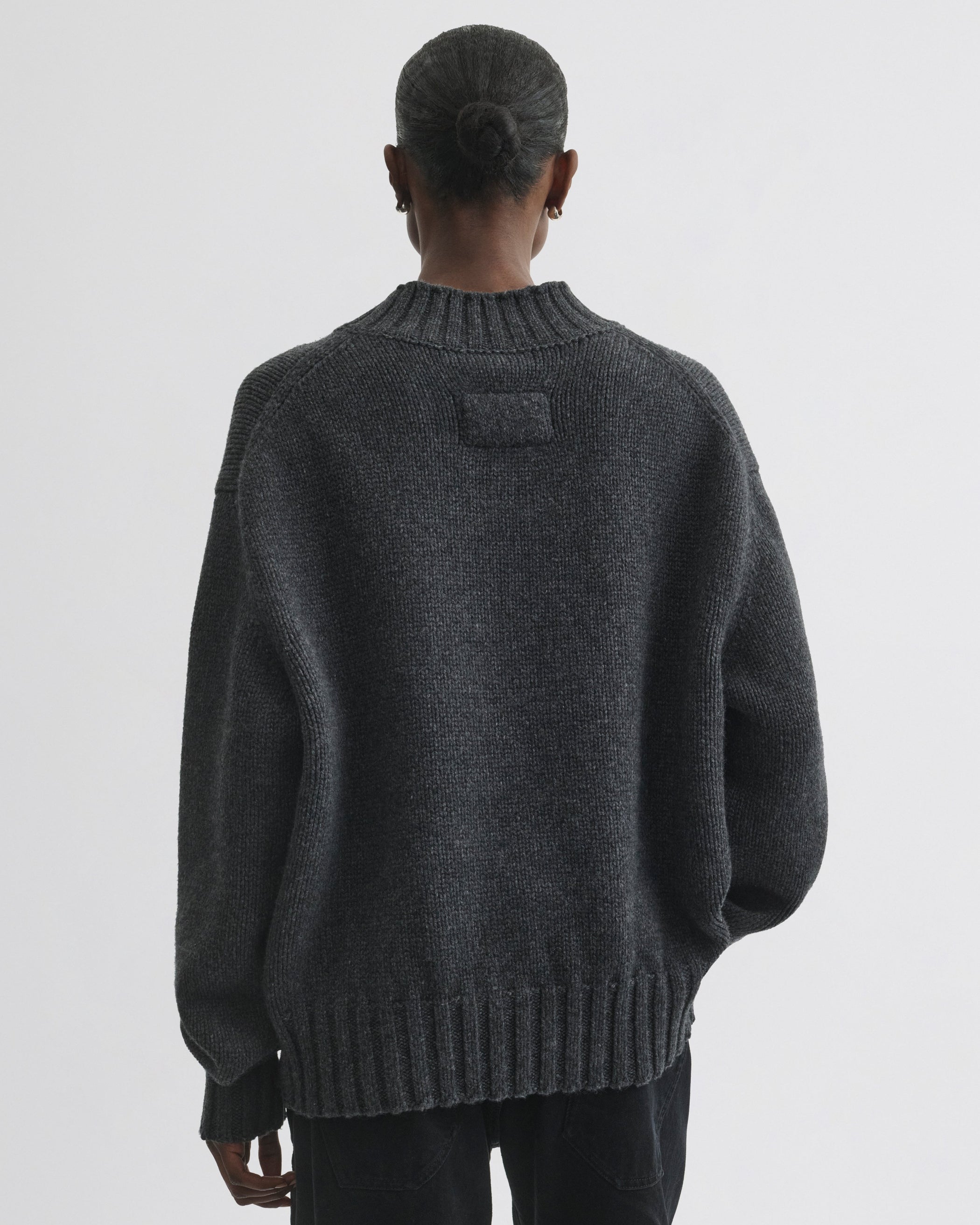 Back view of model wearing Crewneck Jumper in grey cashmere