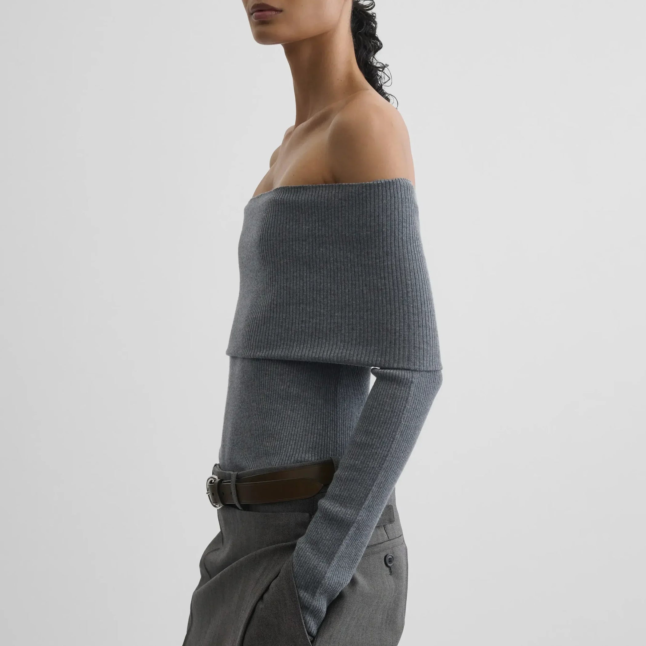 Side view of model wearing FOLDOVER TOP in melange grey wool