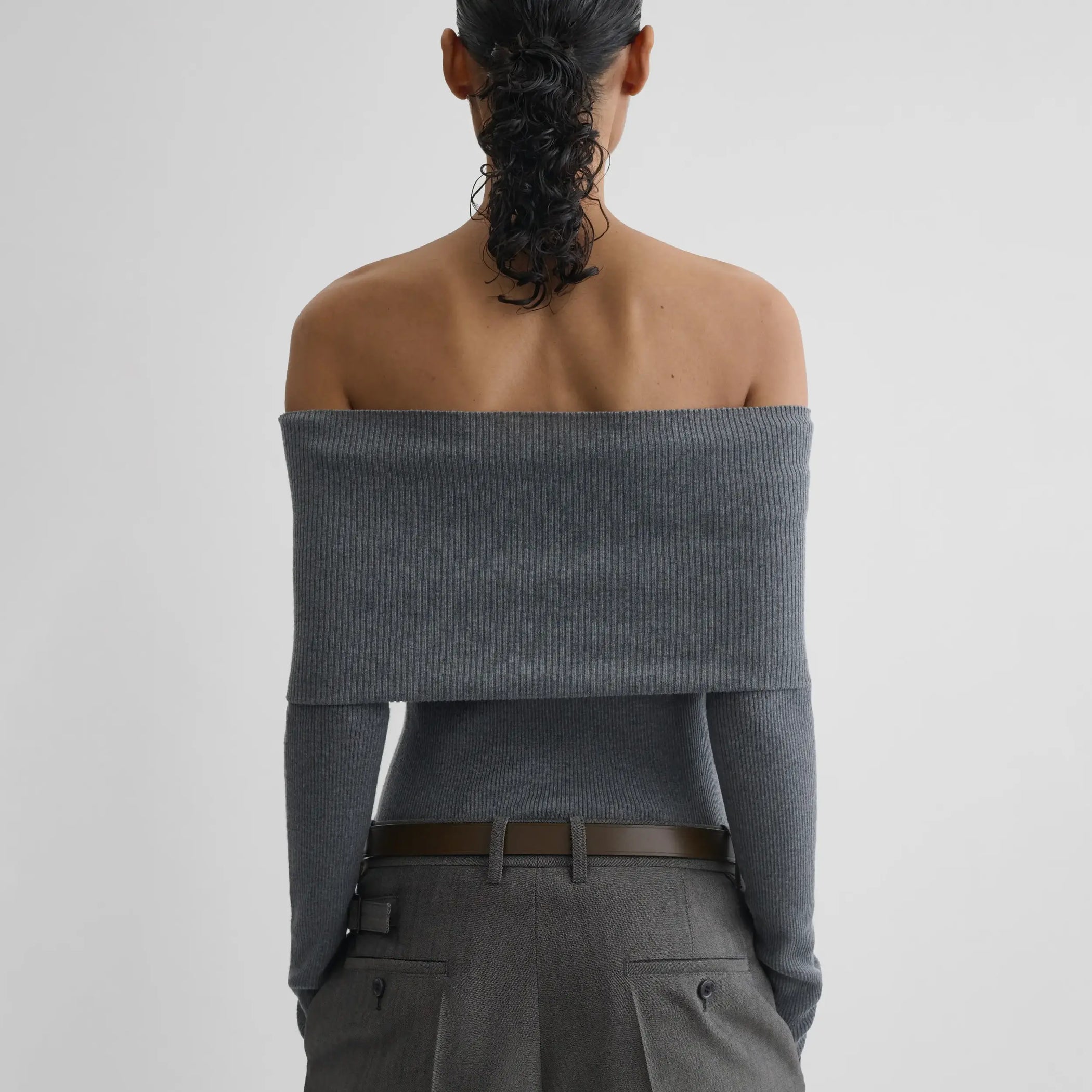 Back view of model wearing FOLDOVER TOP in melange grey wool