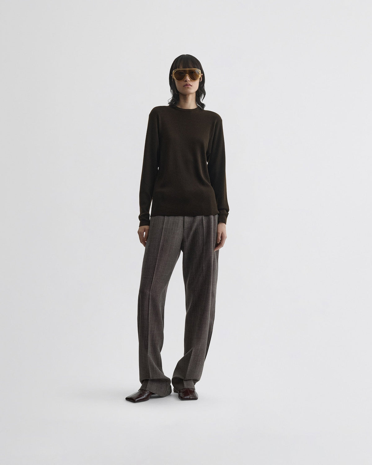 Front view of model wearing RIBBED LONG SLEEVE CREWNECK in dark khaki wool