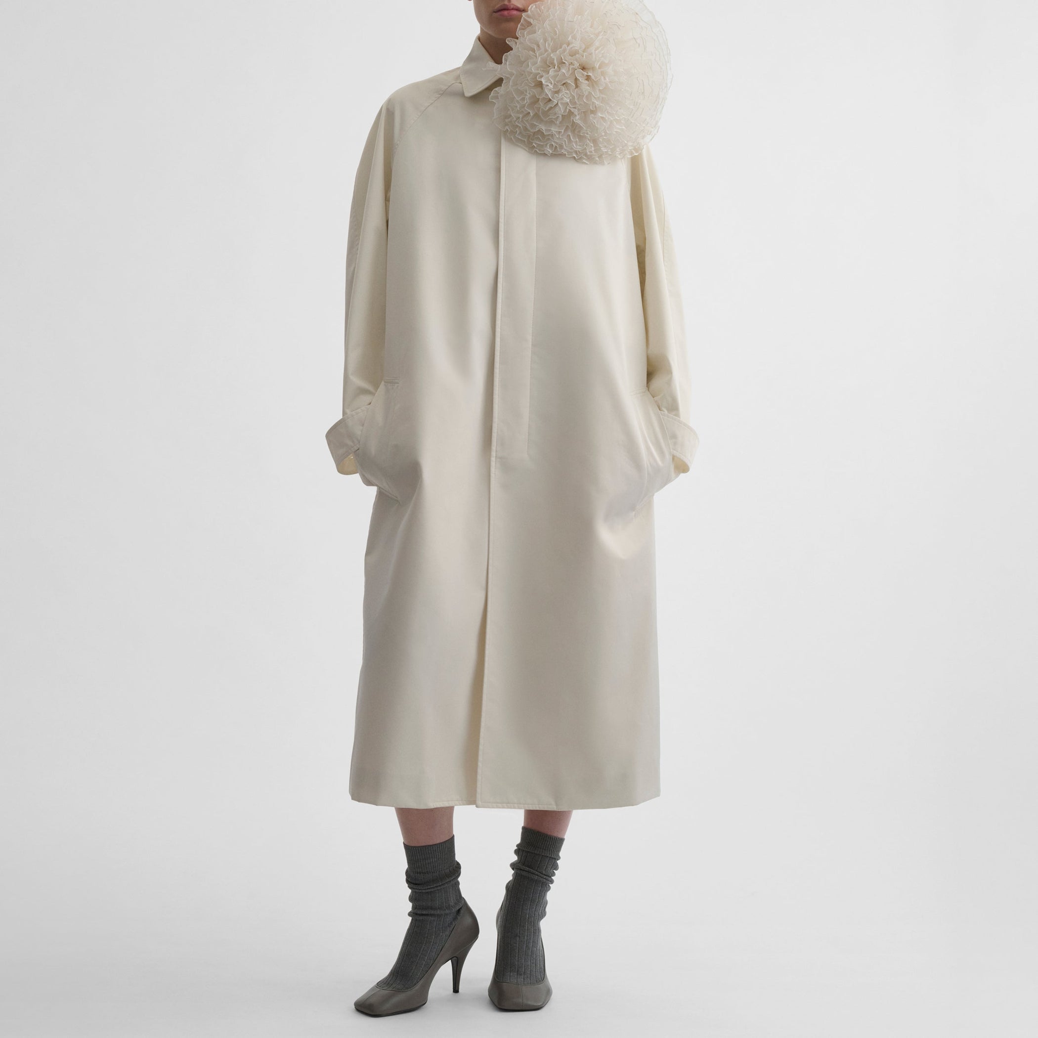 Front view of model wearing COMFY CAR COAT in white blonde technical twill