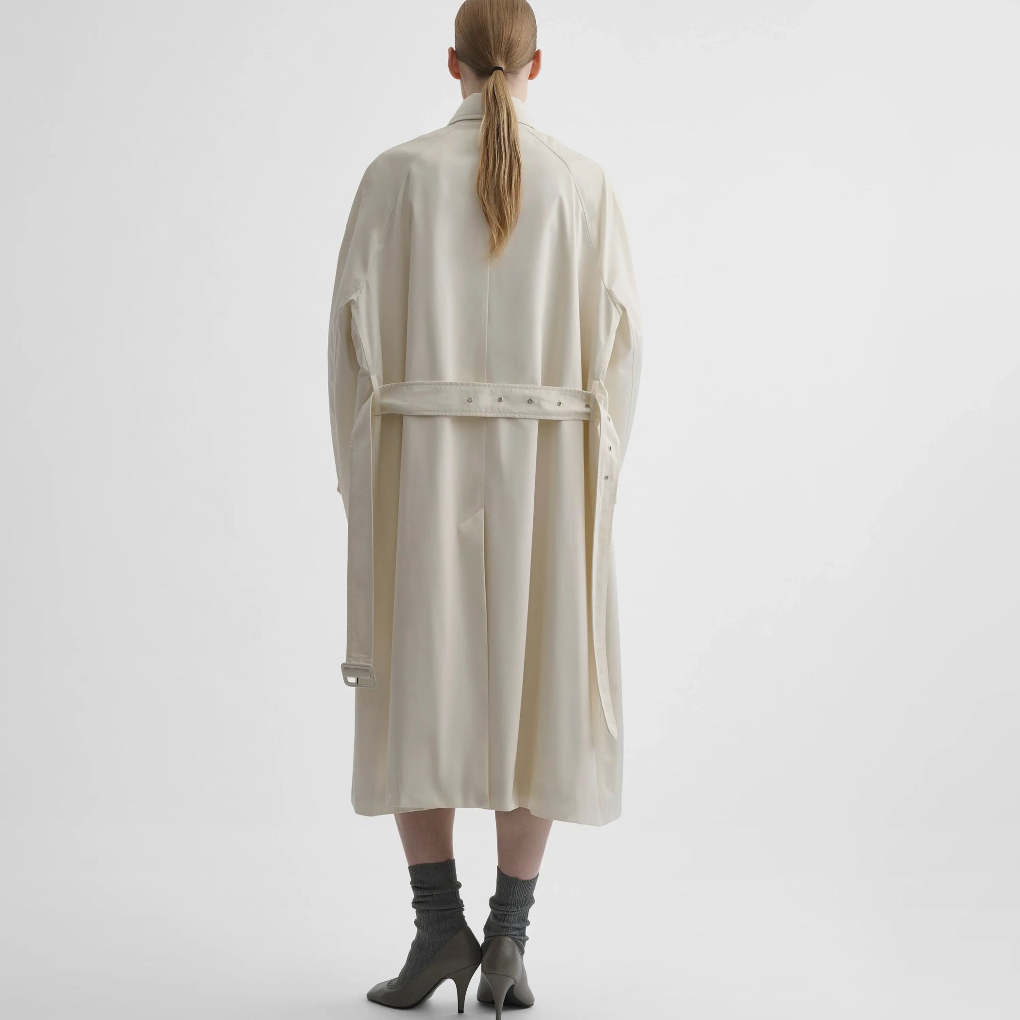 Back view of model wearing COMFY CAR COAT in white blonde technical twill