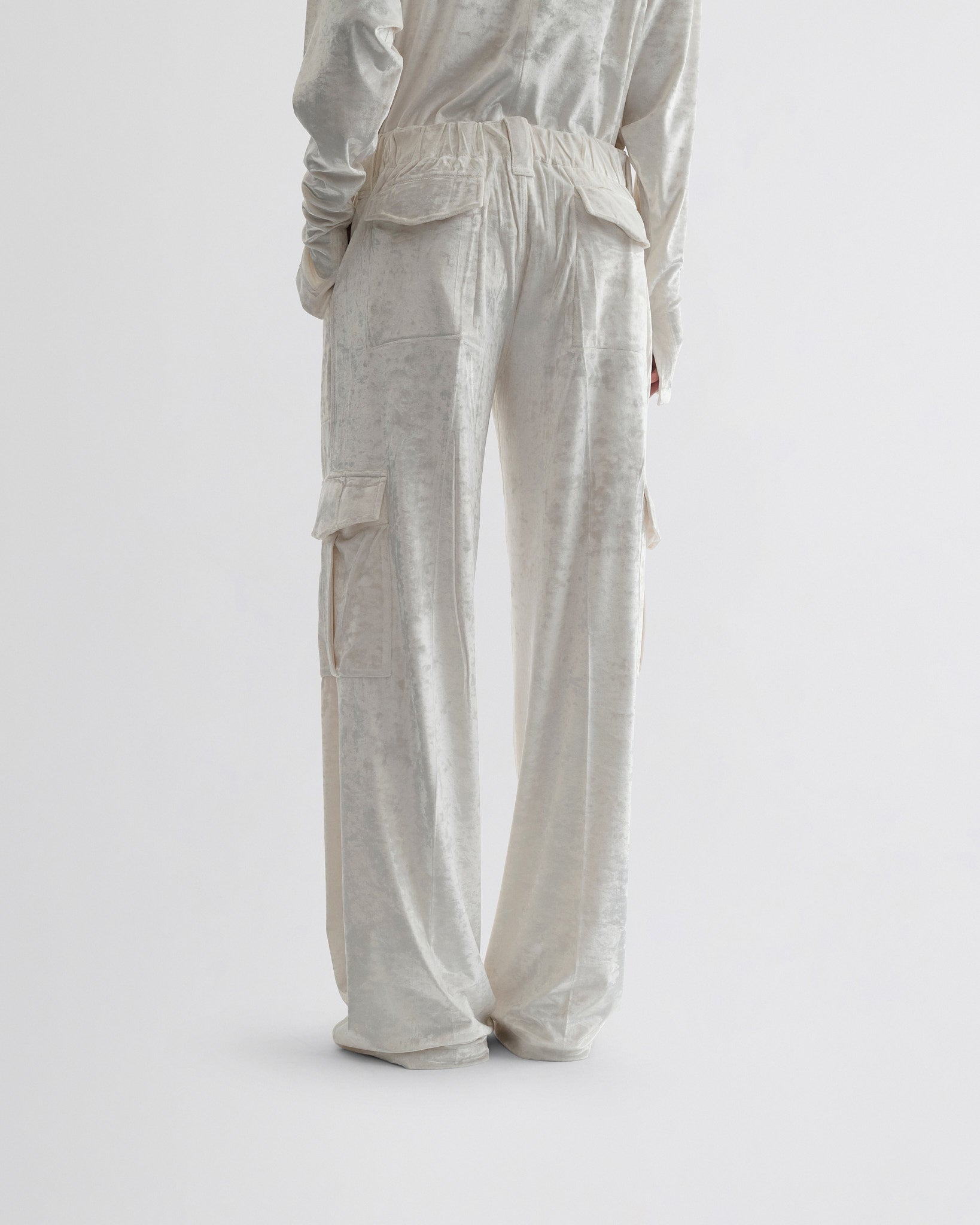 View of liquid cargo trousers in white crushed velvet