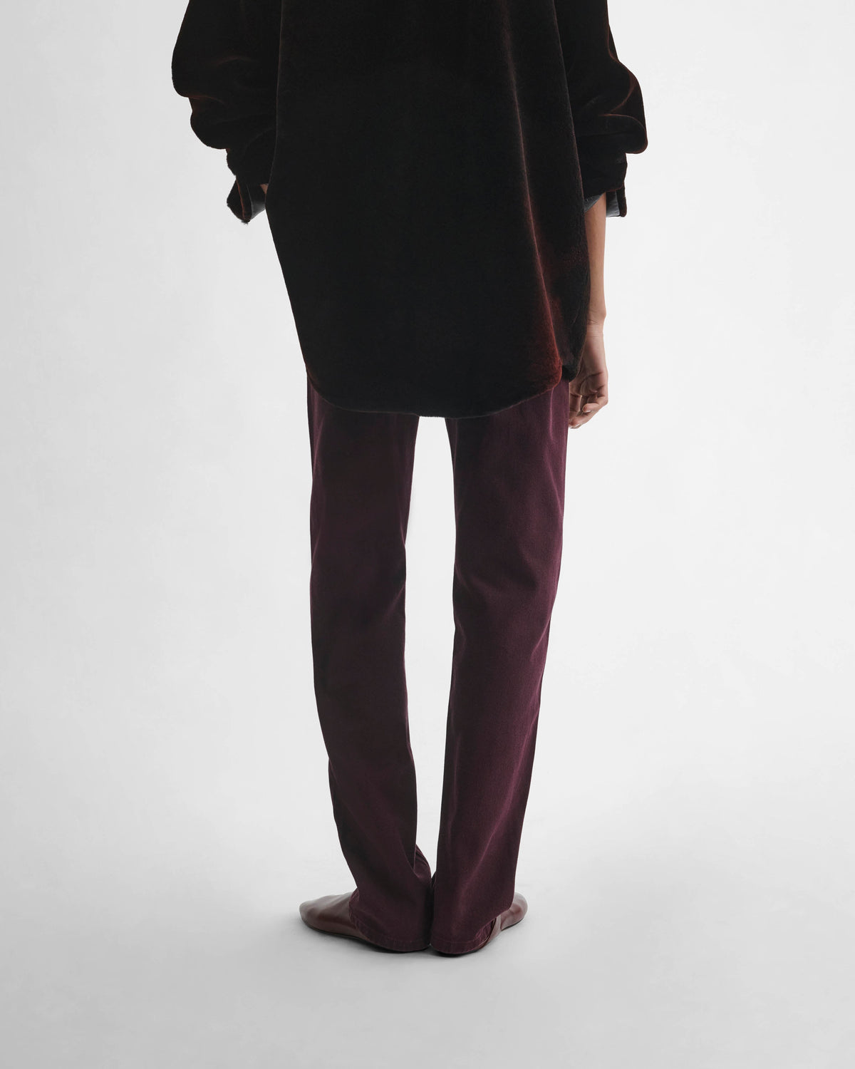 Back view of model wearing CLASSIC JEANS in dark berry cotton