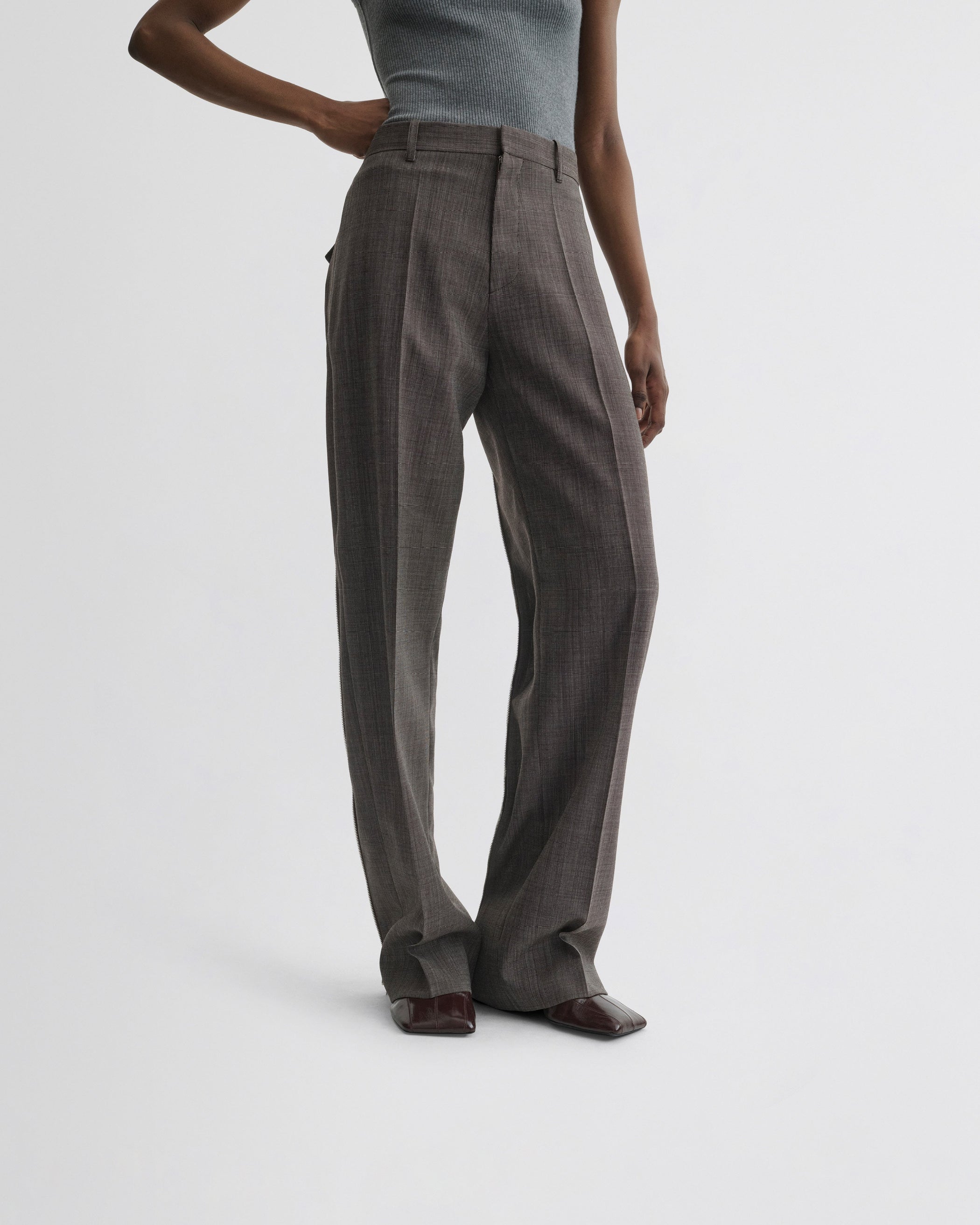 View of split zip trousers in dark brown mélange wool