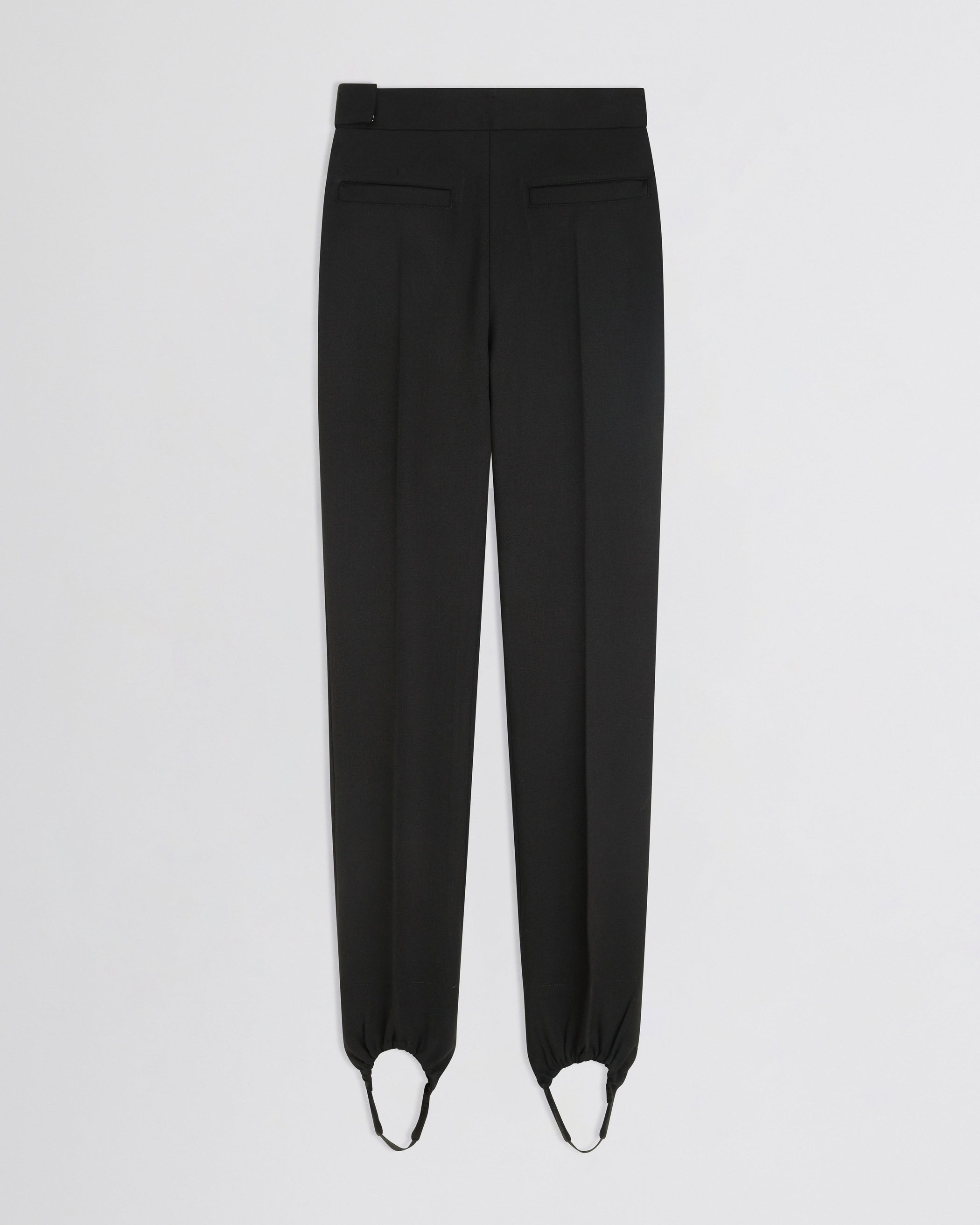 Flat back view of Stirrup Trousers in black wool