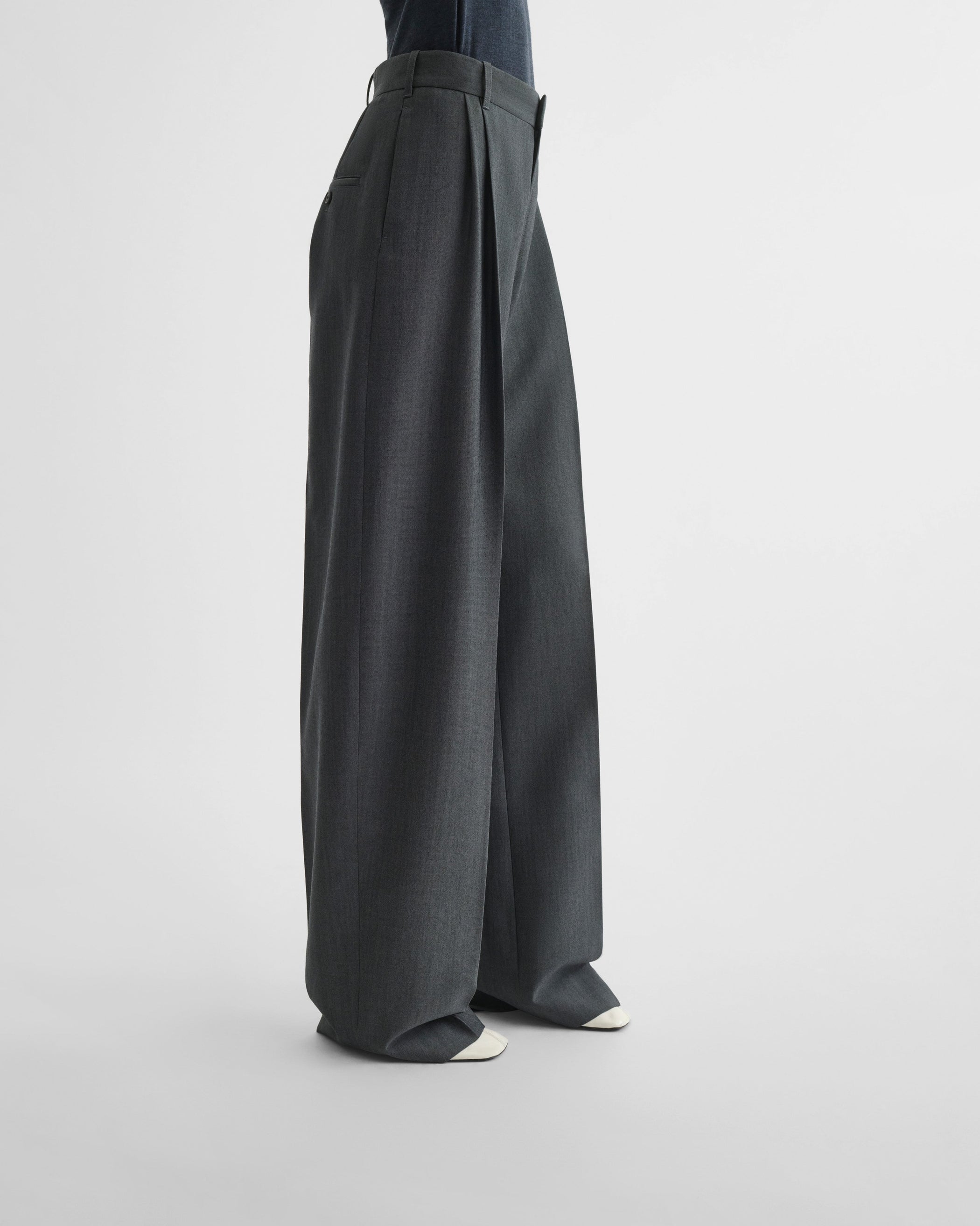 View of double pleat trousers in grey mélange wool