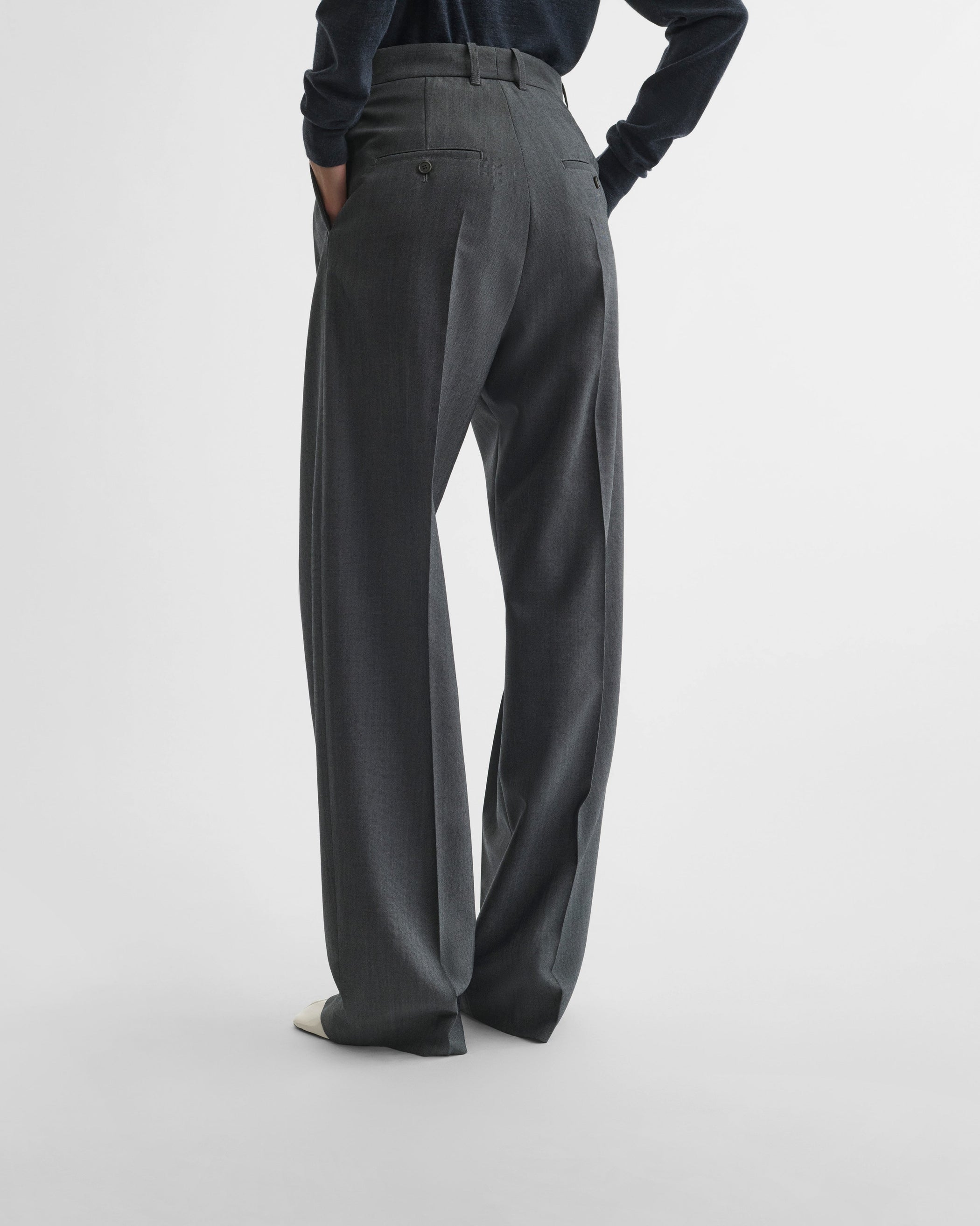 View of double pleat trousers in grey mélange wool