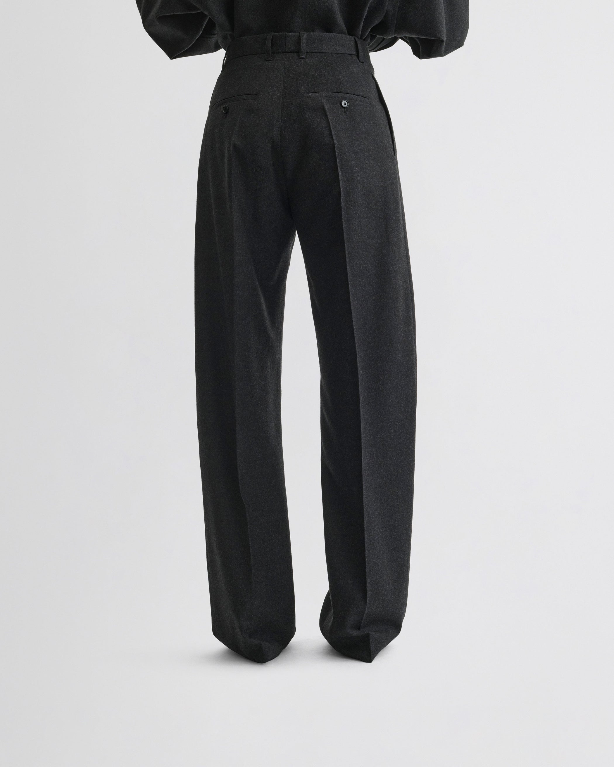 View of double pleat trousers in charcoal wool