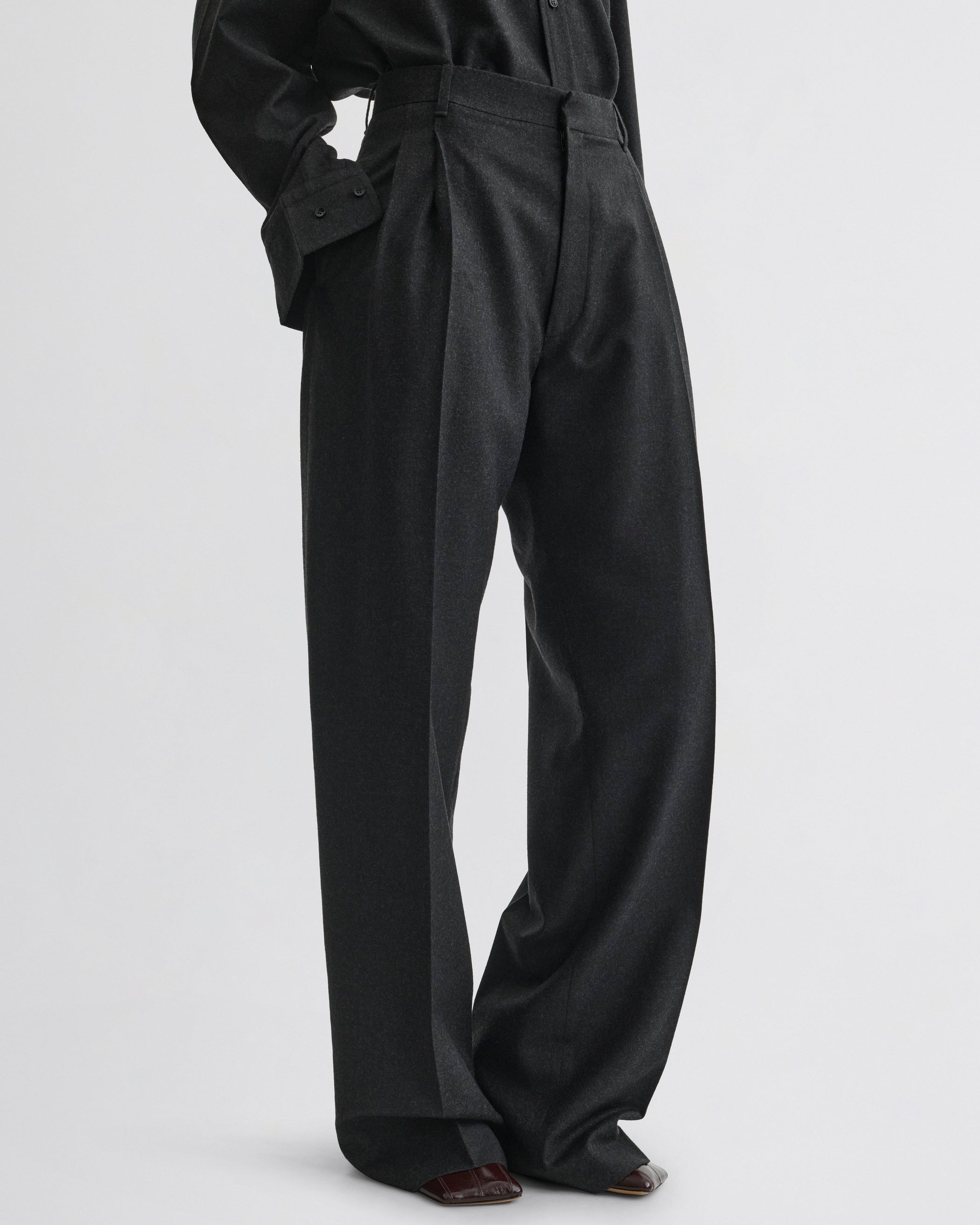 Side view of Double Pleat Trousers in charcoal wool