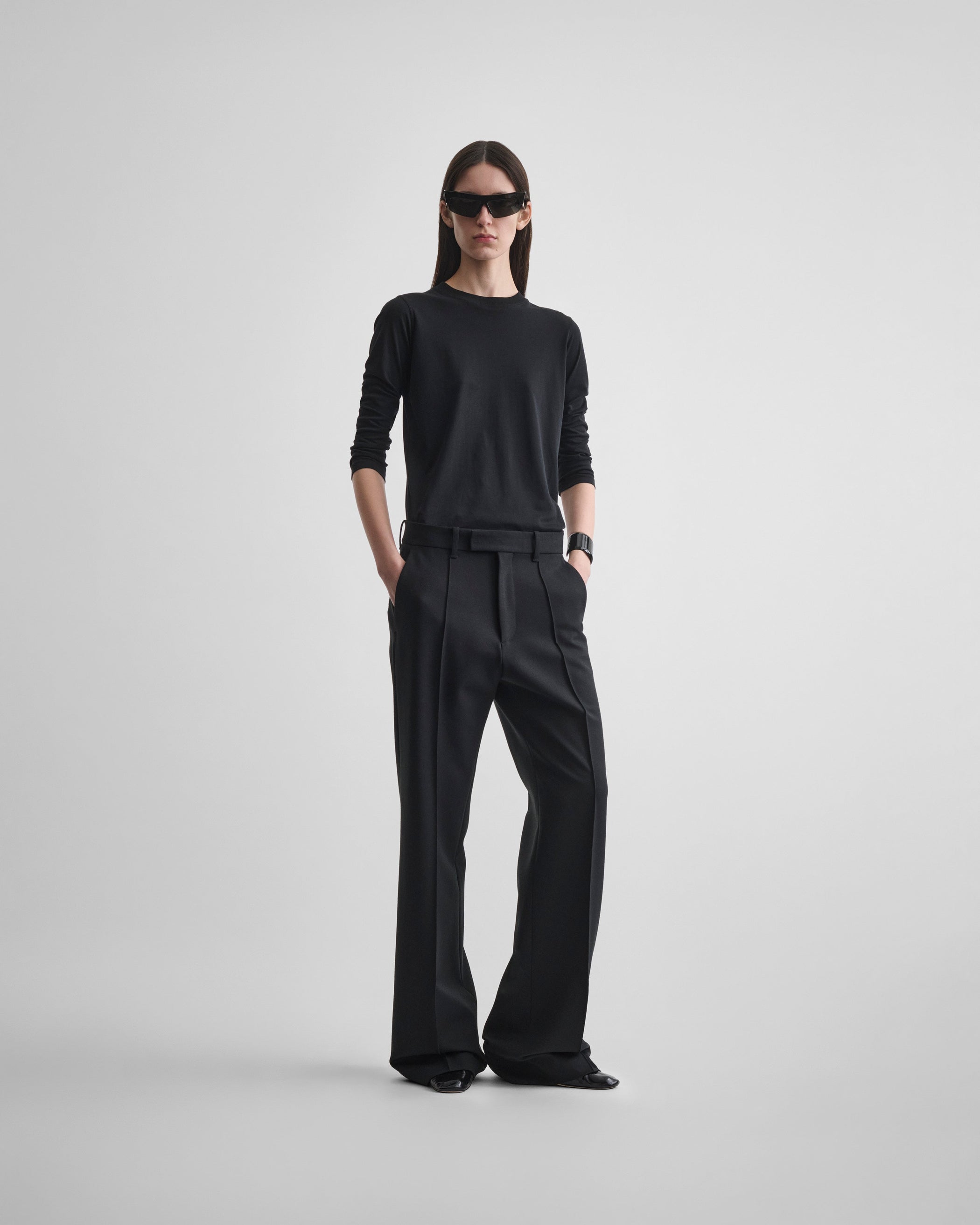Front view of model wearing BOYISH TAILORED TROUSERS in black wool