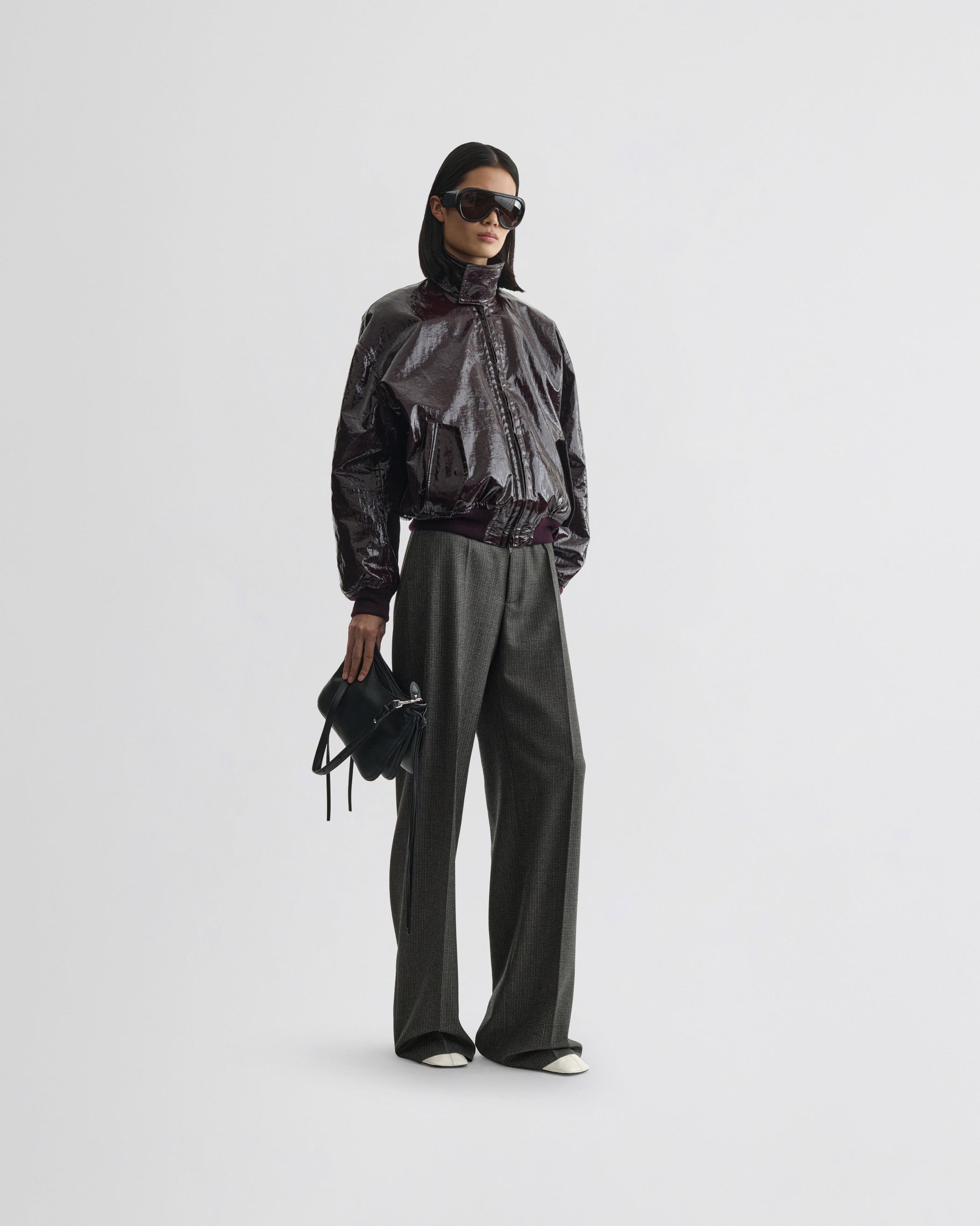 View of Zip trousers in grey brown melange. [hoover]