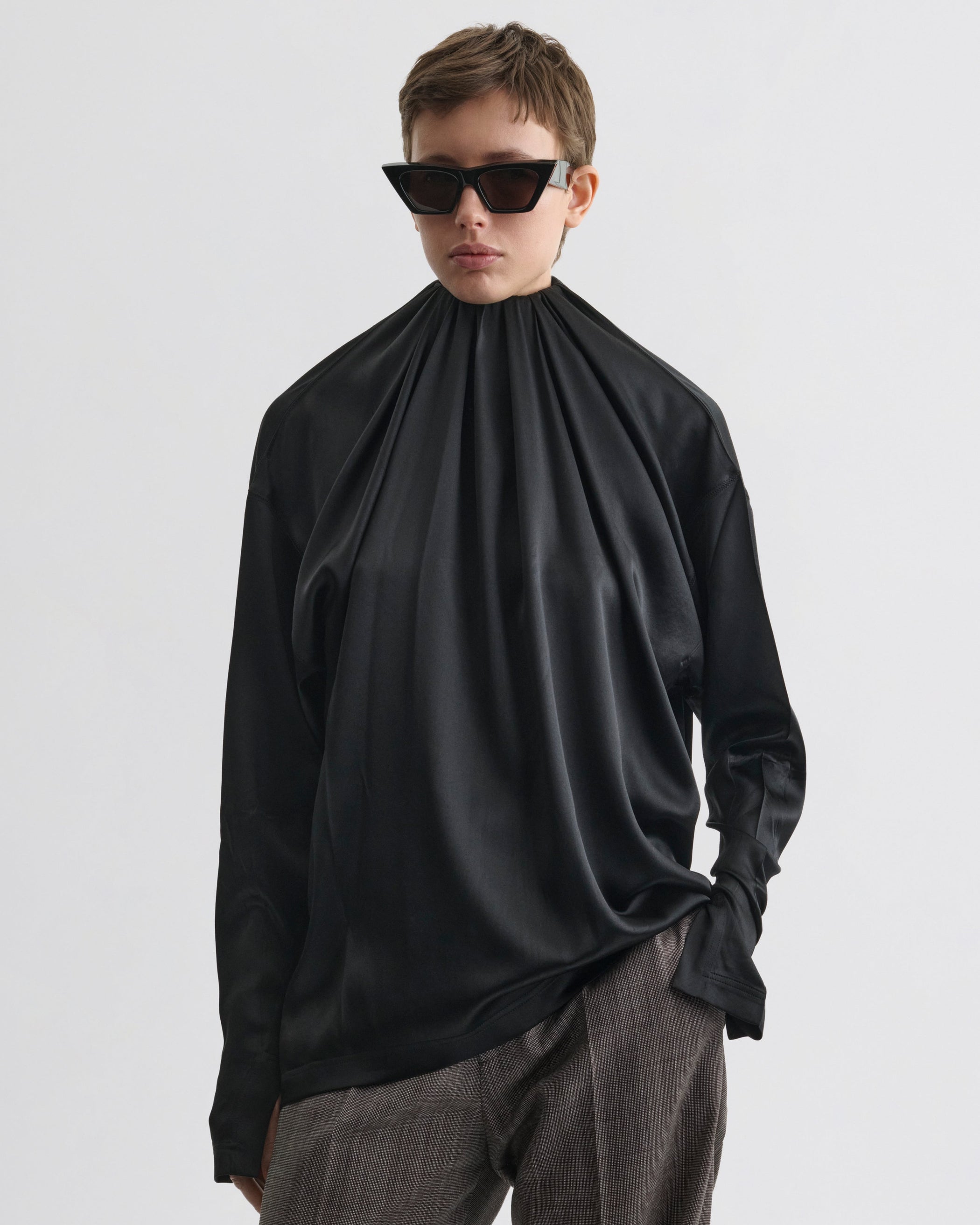 Front view of model wearing LIQUID SOFT RIDGE TOP in black silk
