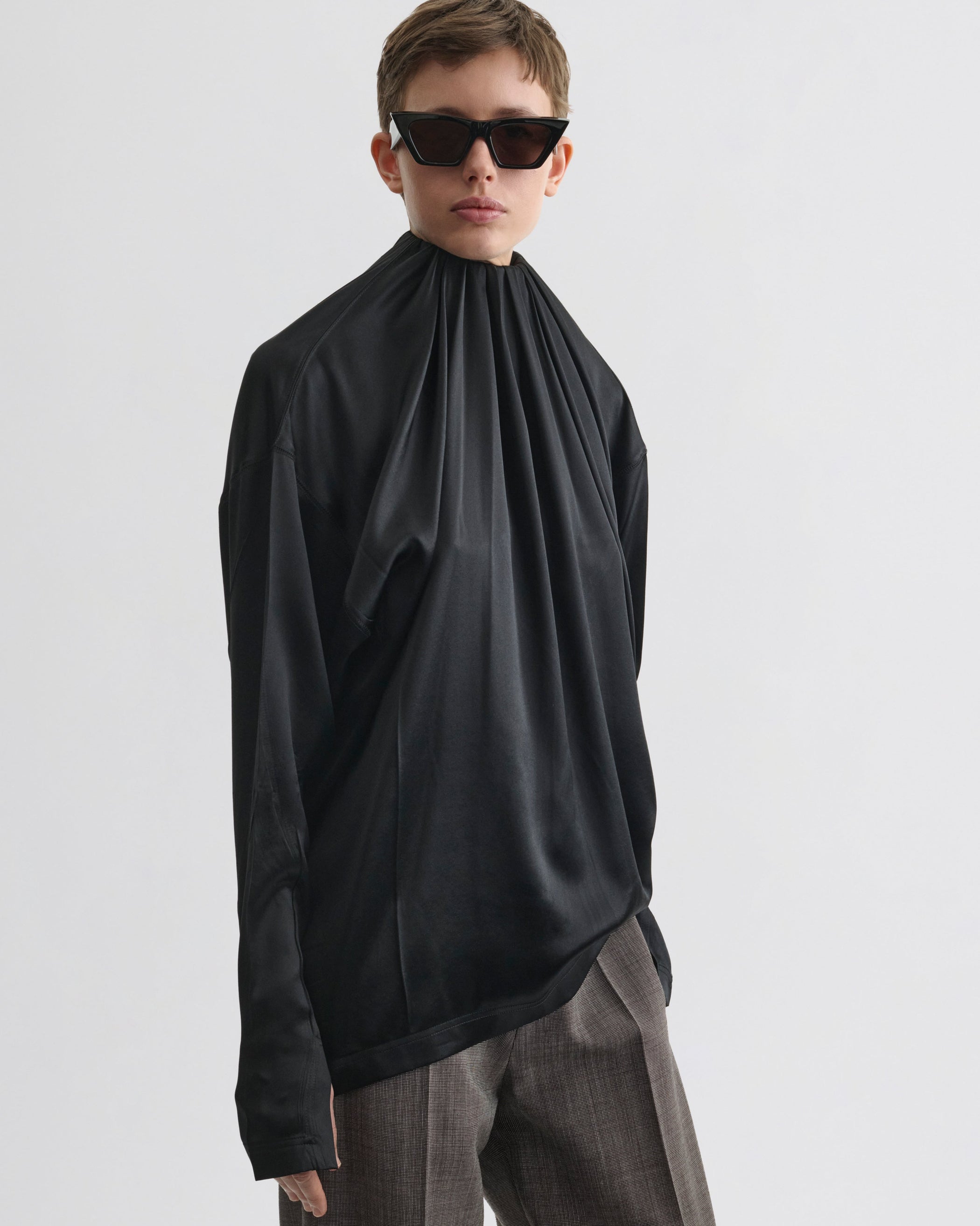 Front view of model wearing LIQUID SOFT RIDGE TOP in black silk
