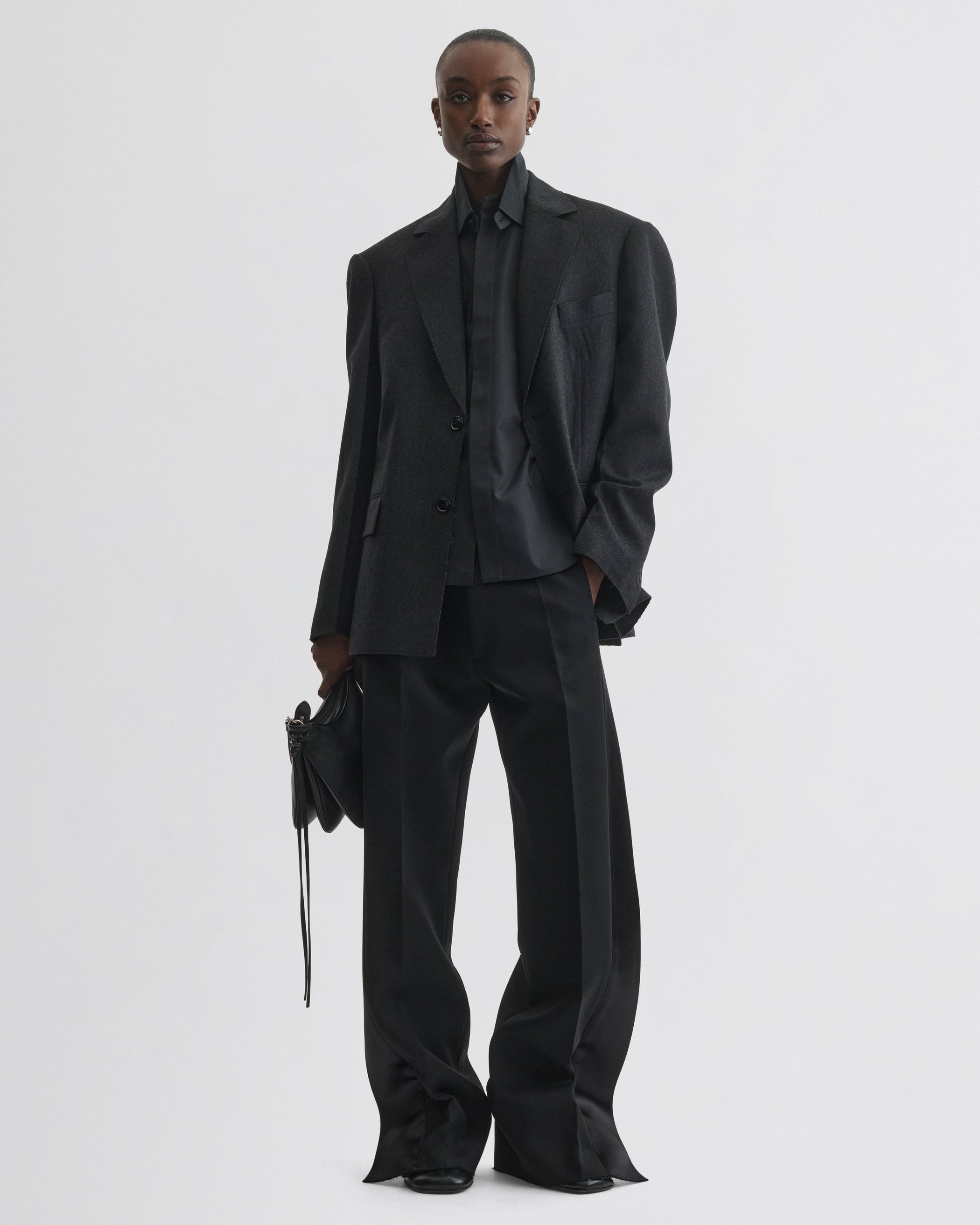 Front view of model wearing Tuxedo Jacket in anthracite wool
