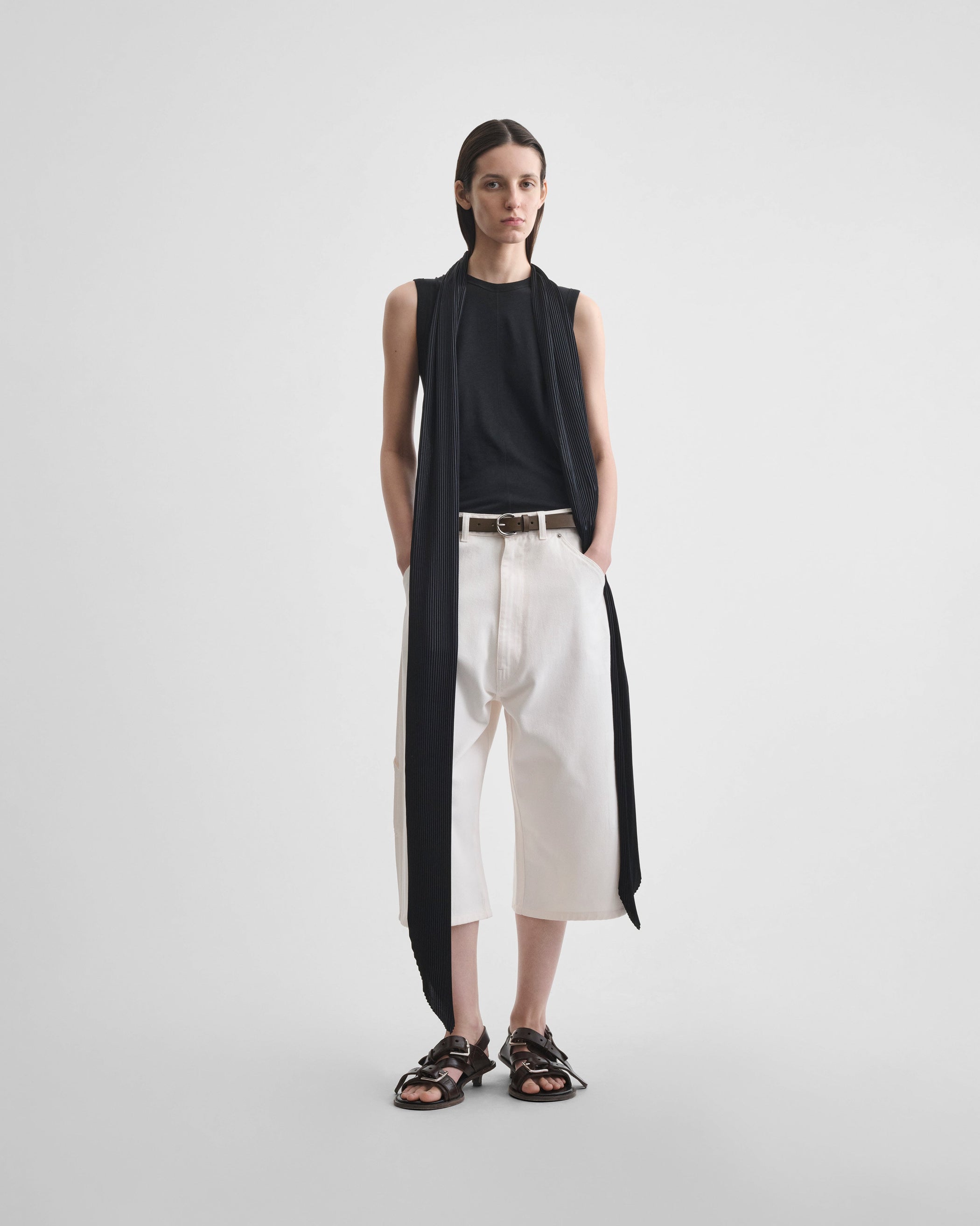 Front view of model wearing LONG PLEATED SCARF in black silk