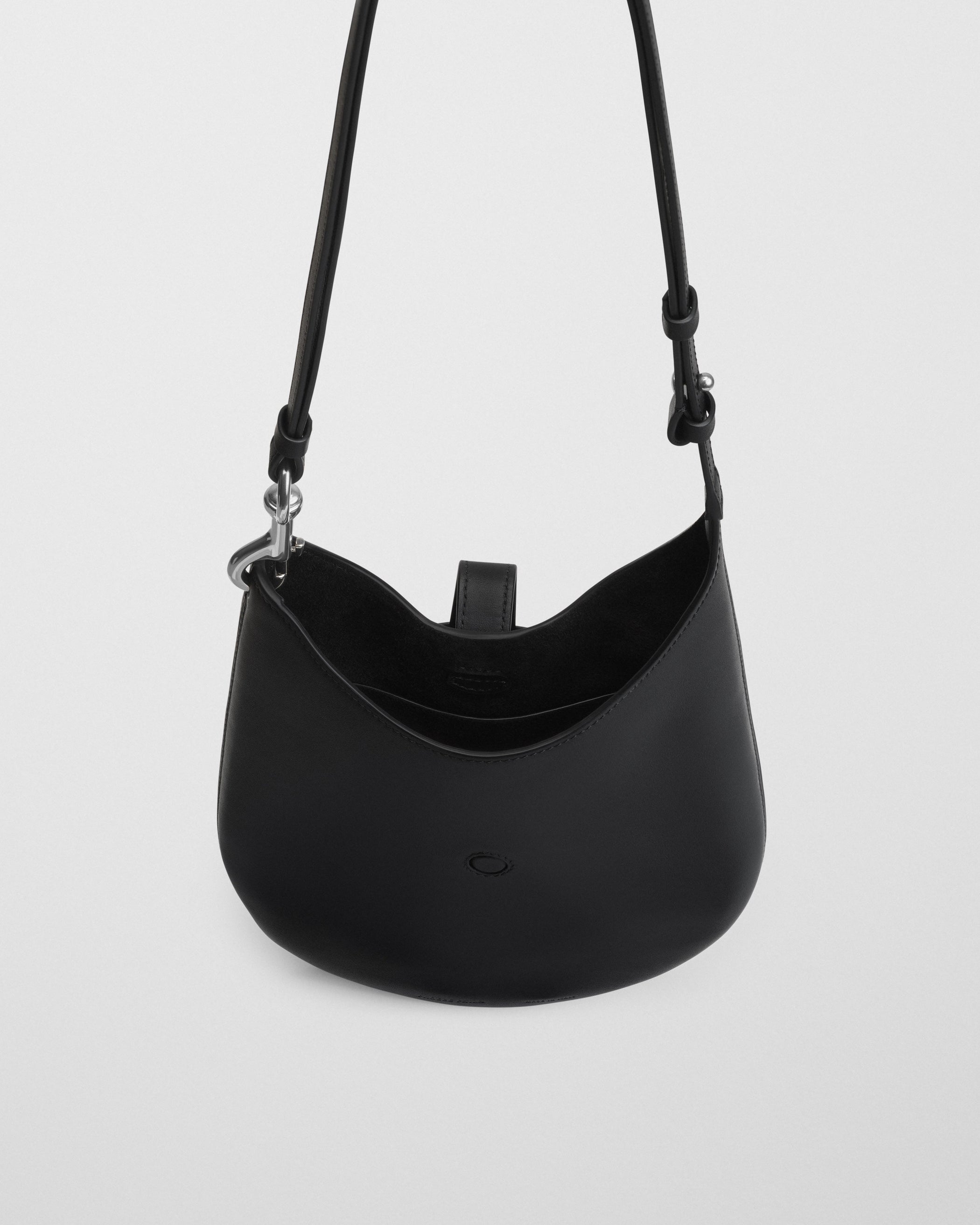 Close up detail view of MINI BEAN SLING in black leather