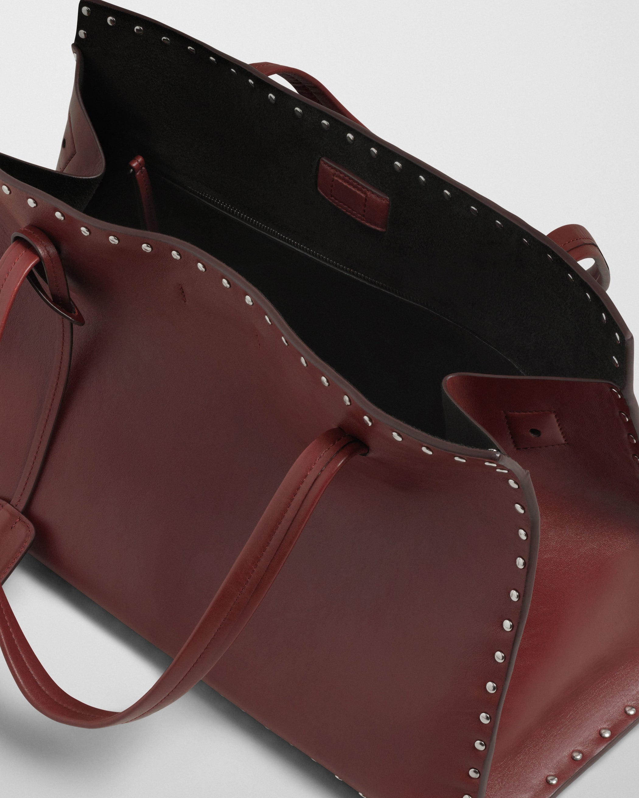 Close up detail view of SMALL STUD CABAS in chestnut leather