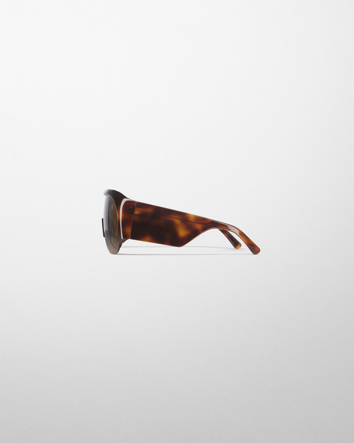 Side view of HALF BOMBÉ SUNGLASSES in cognac tortoiseshell acetate