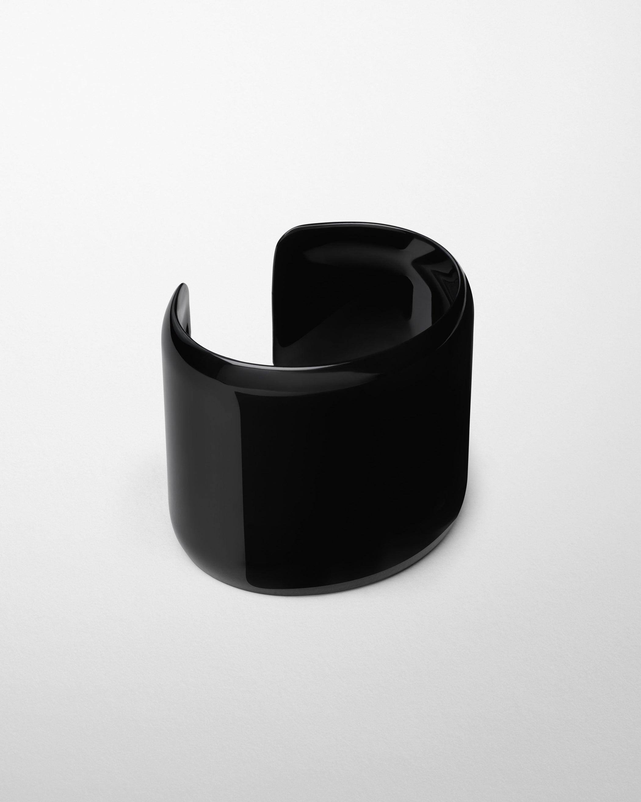 Angled side view of PURE BANGLE in black