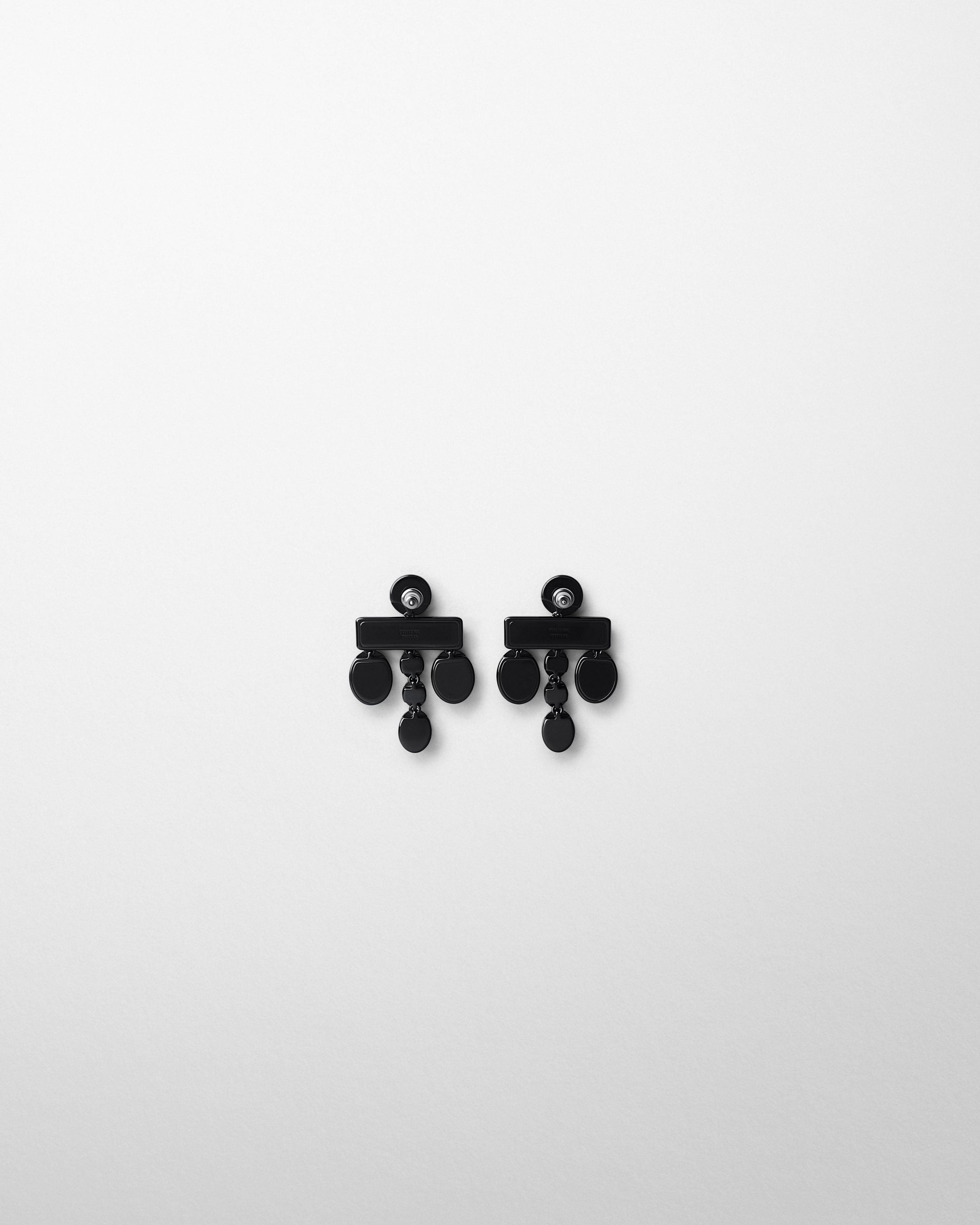 Flat back view of DROPLET CHANDELIER EARRINGS in black
