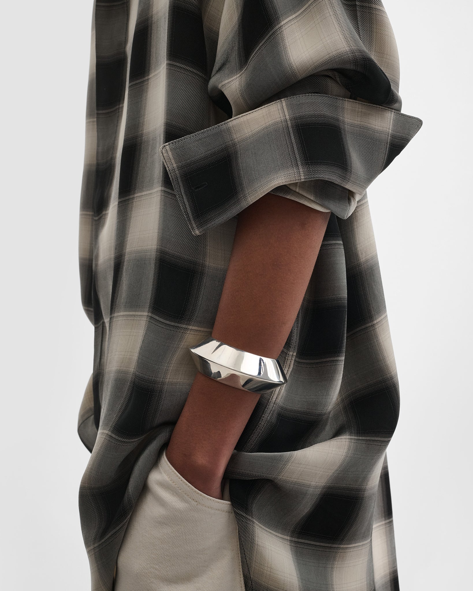 Side view of model wearing ORB CUFF in silver