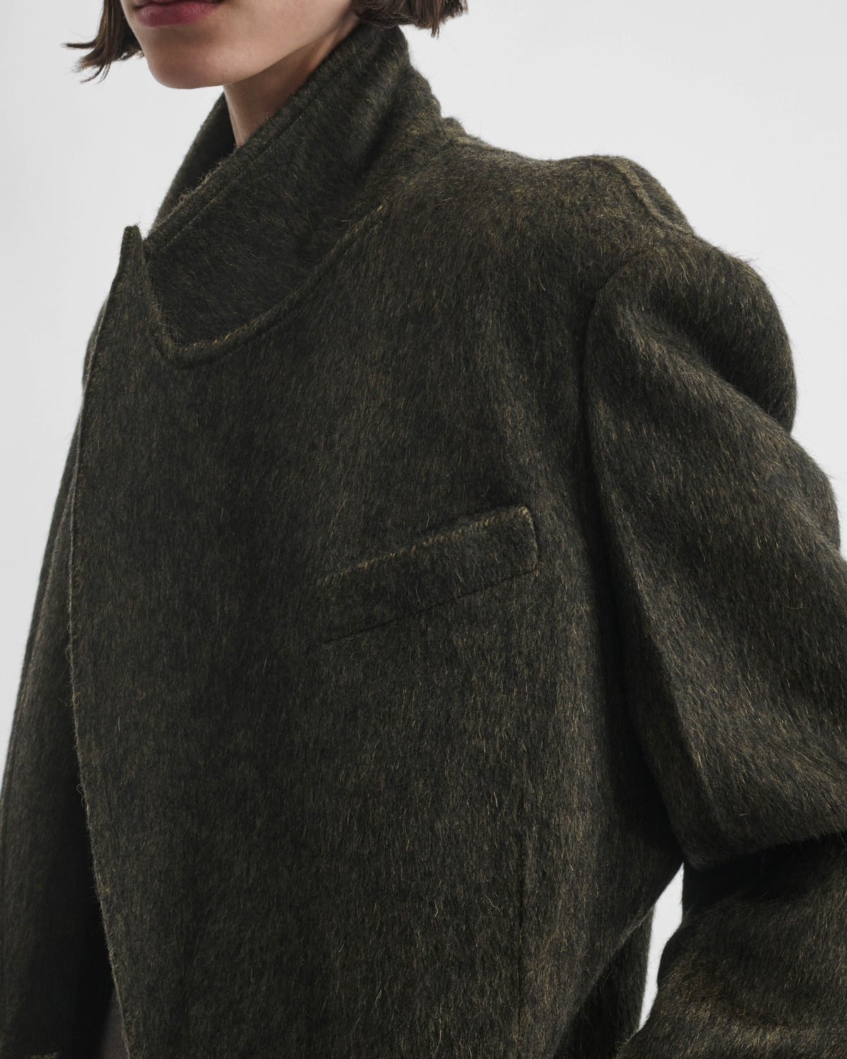 Close detail shot of model wearing KINKED JACKET in anthracite wool