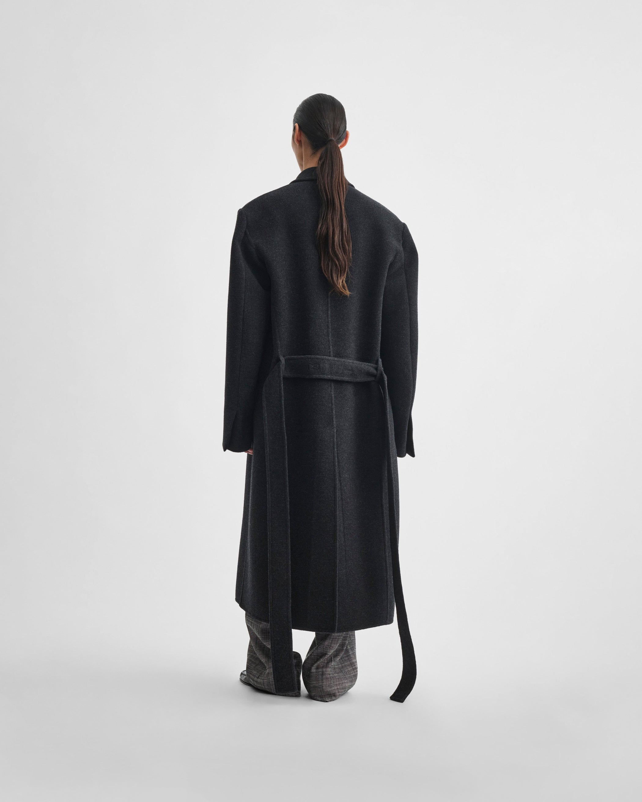 Back view of model wearing MAN'S ROBE COAT in anthracite wool