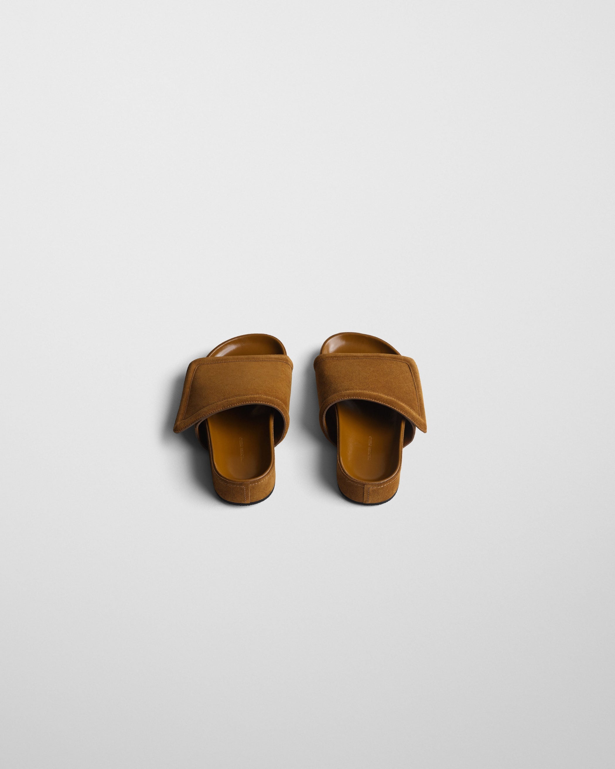 Back angled view of WIDE SLIDE in toffee suede