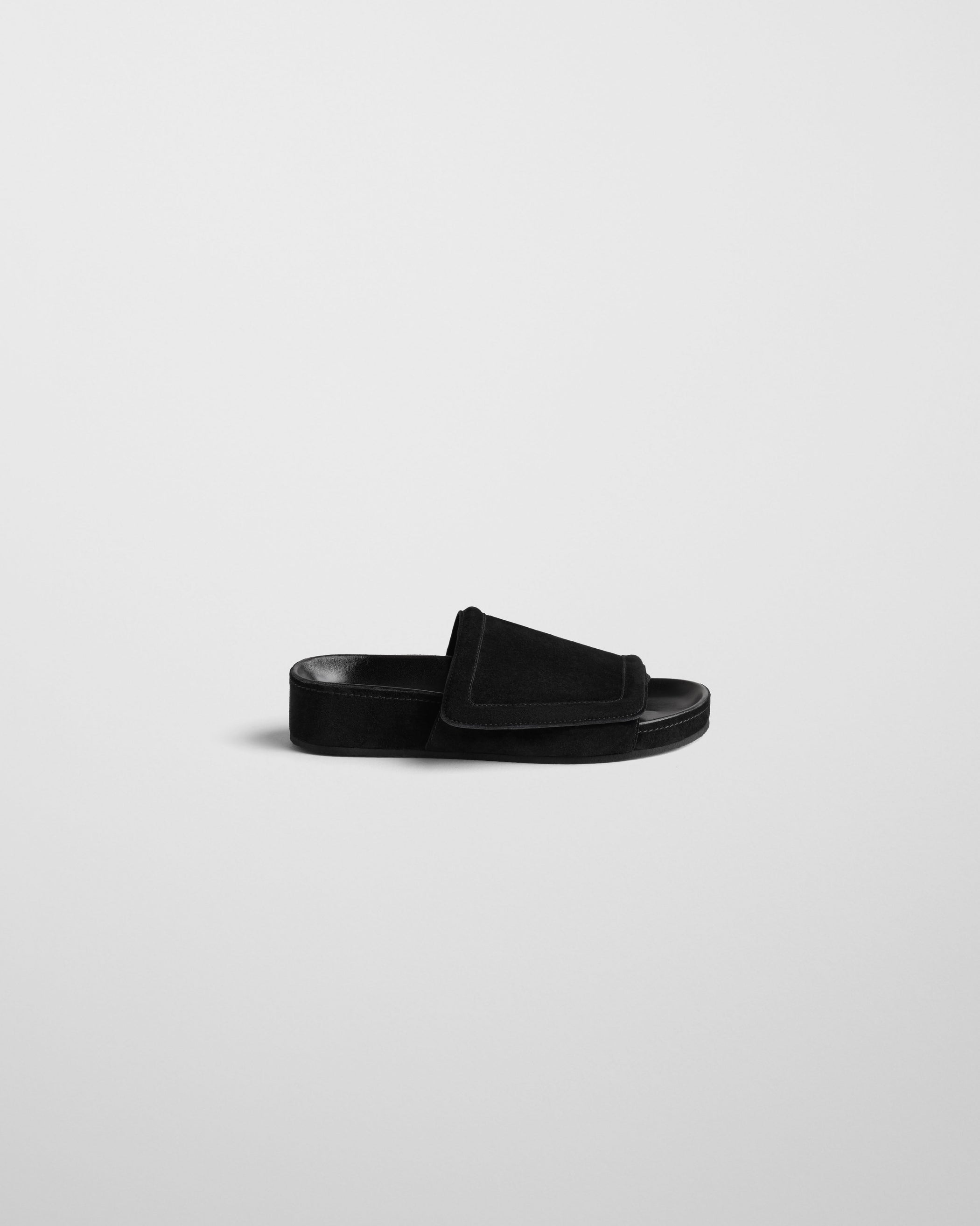 Side view of WIDE SLIDE in black suede