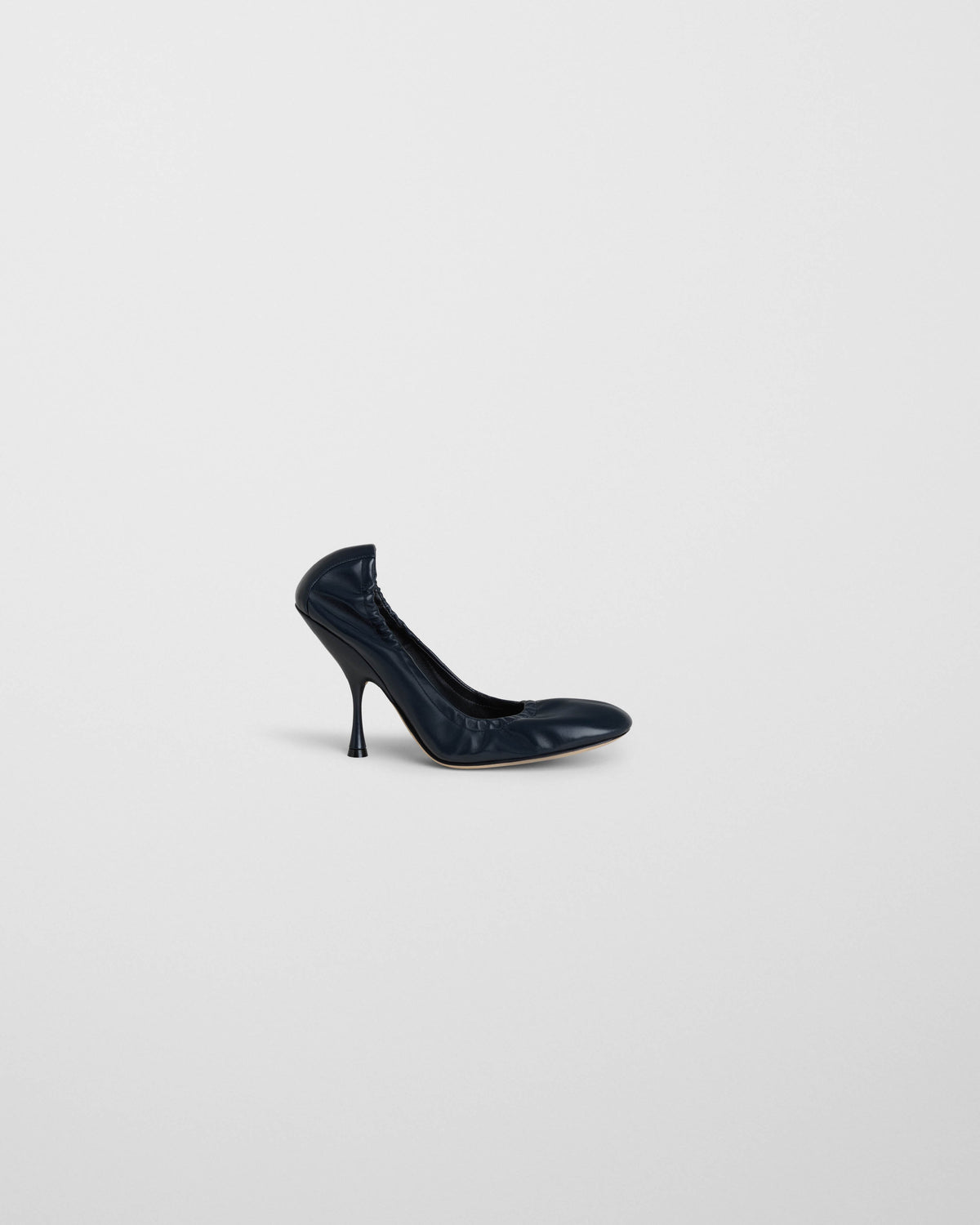 Side view of PUCKER PUMP 100 in dark navy leather