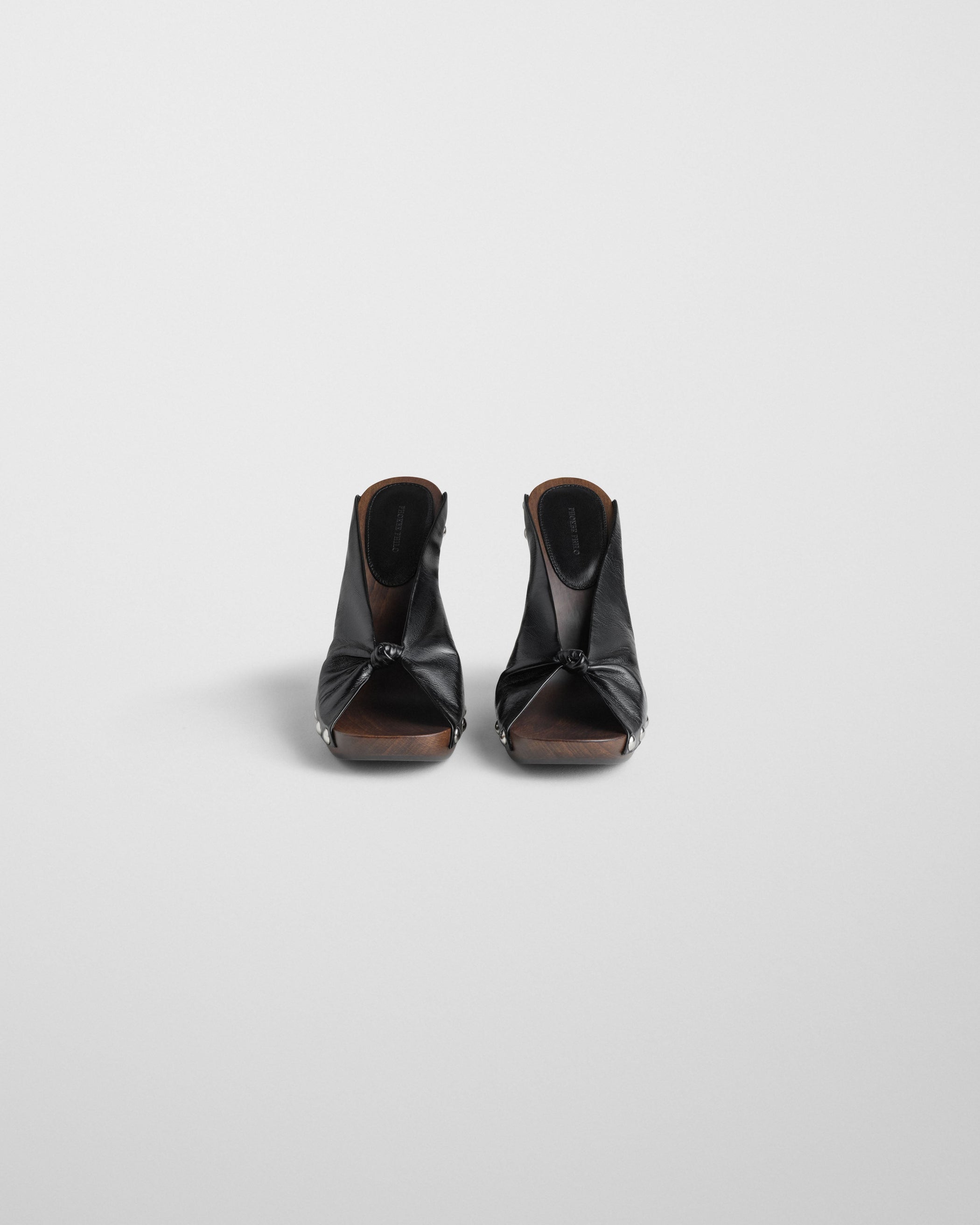 Front view of KNOTTED CLOG in black leather