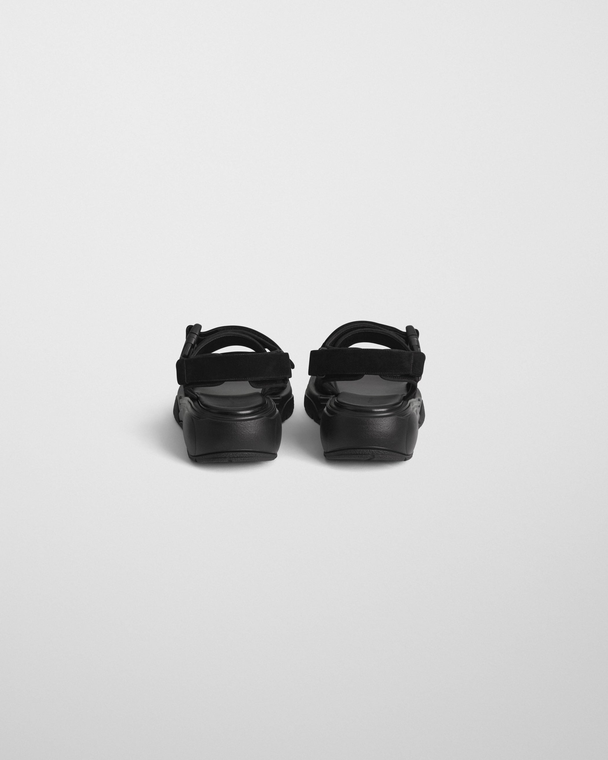 Back view of PACE RUNNER in black suede