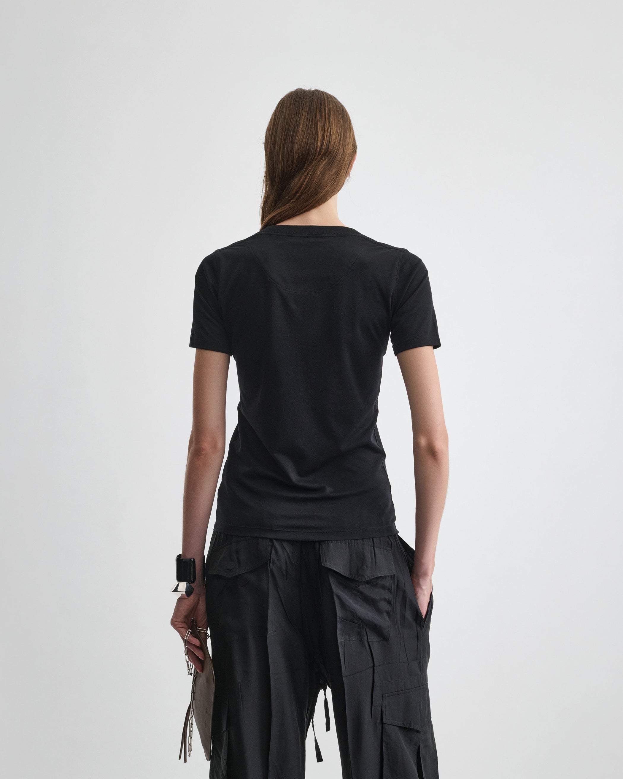 Back view of model wearing SCOOP T. in black cotton