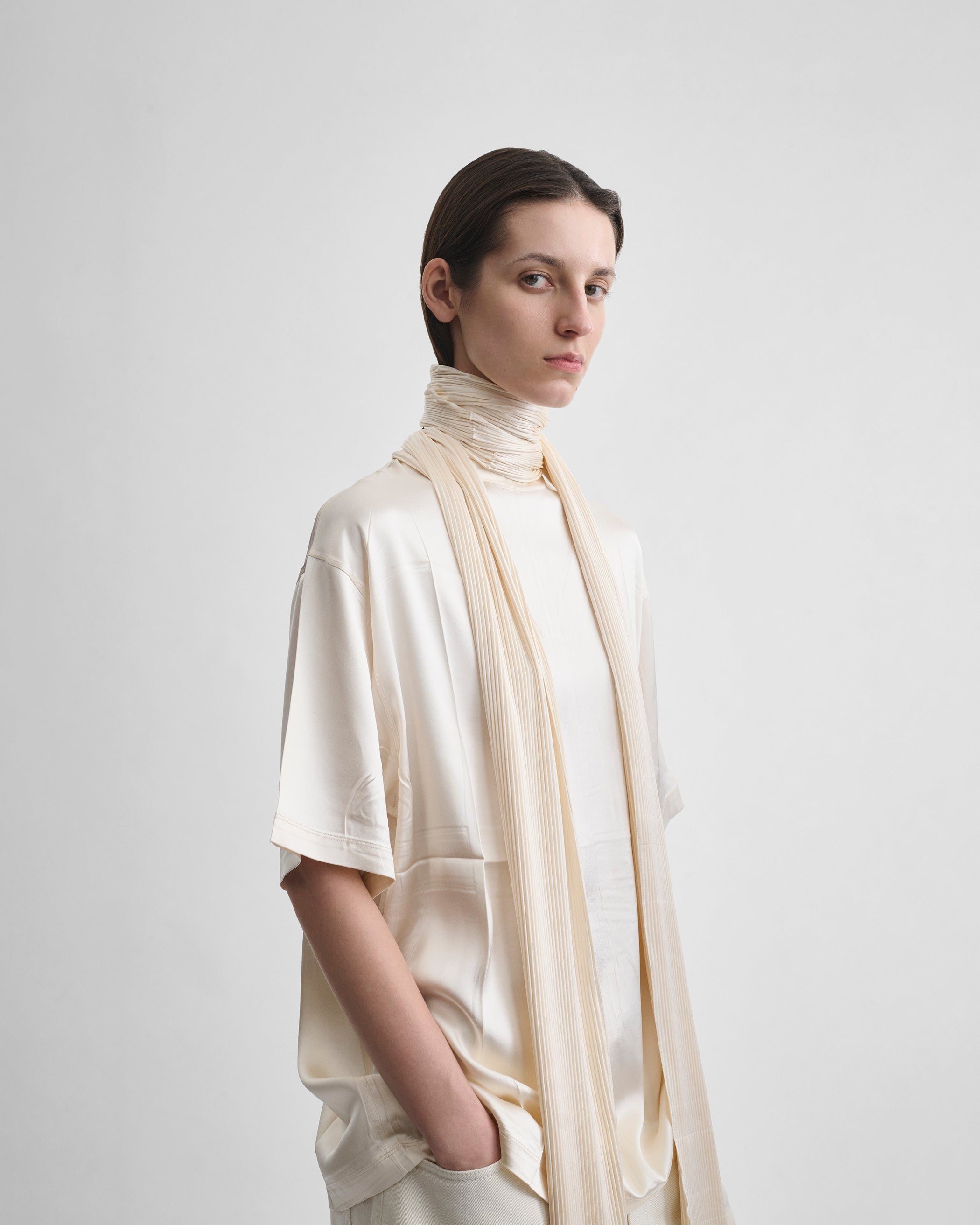 Angled front view of model wearing SILK SCARF T-SHIRT in cream silk