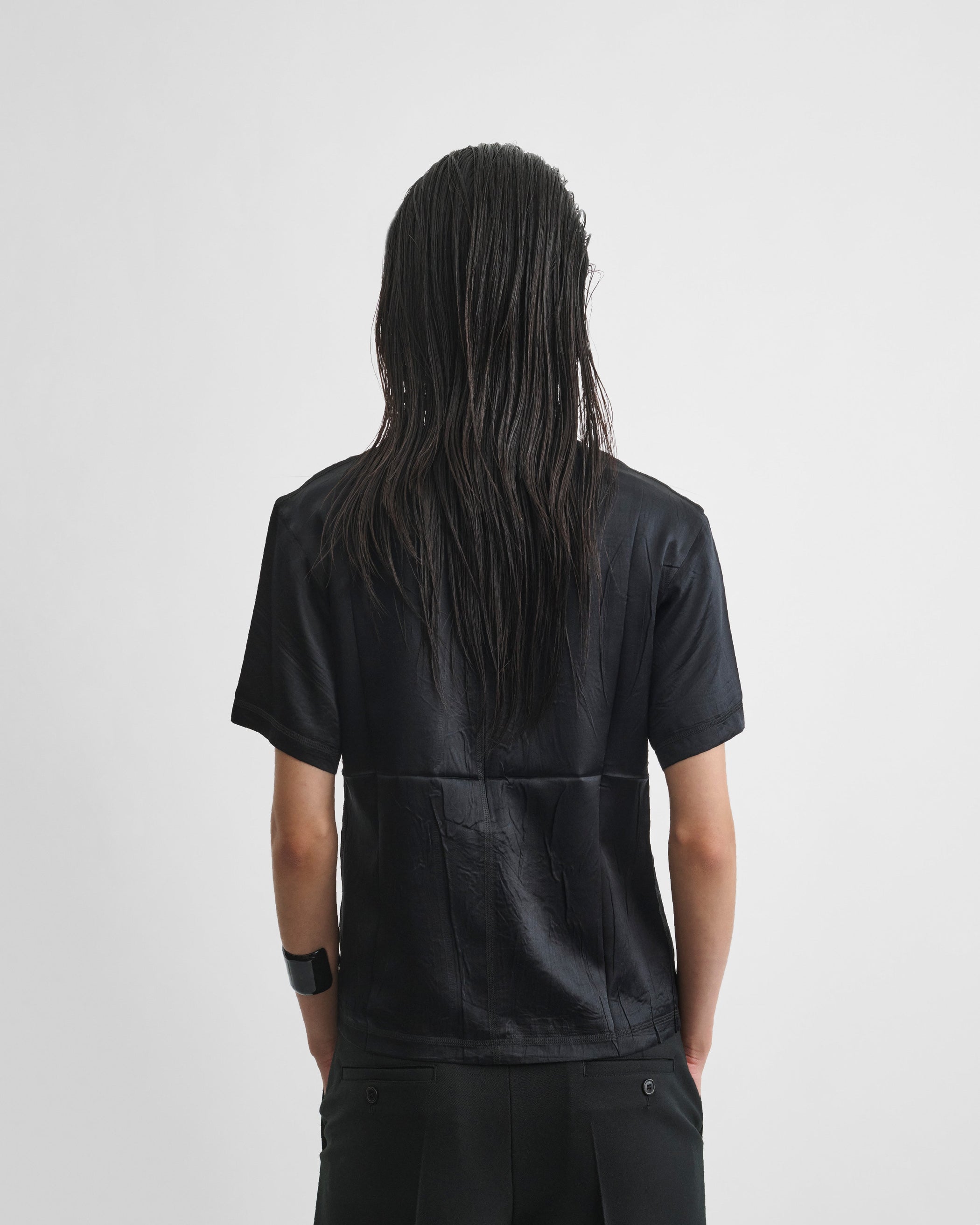 Back image of model wearing GRAPHIC T in black silk