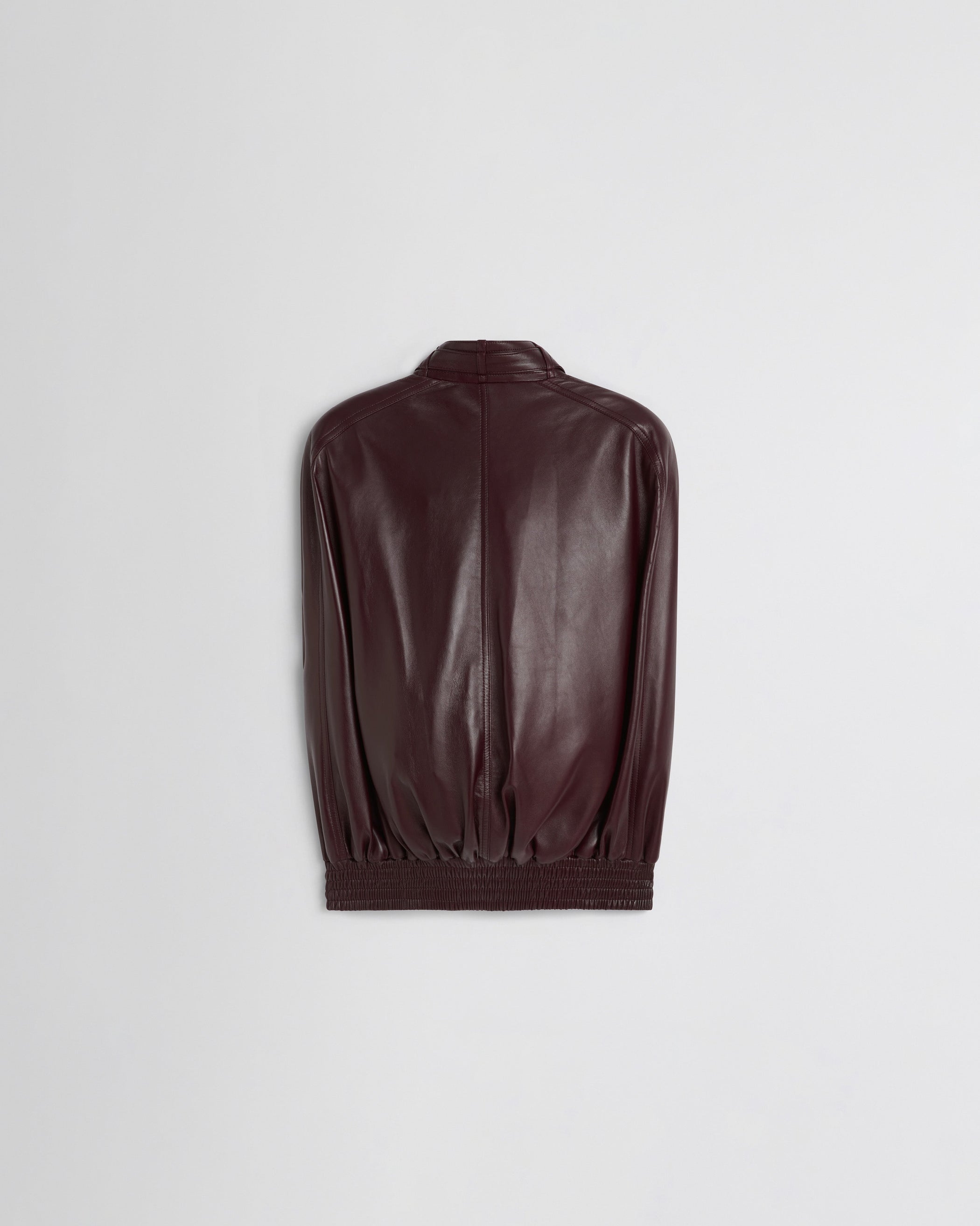 Flat back view of CAPE BOMBER in merlot leather