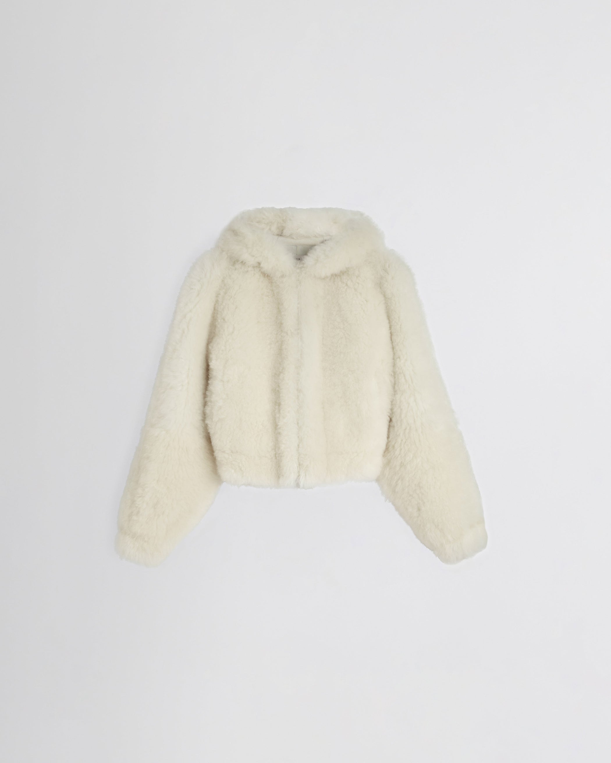 Flat front image of SUPER TEDDY HOODIE in ivory shearling